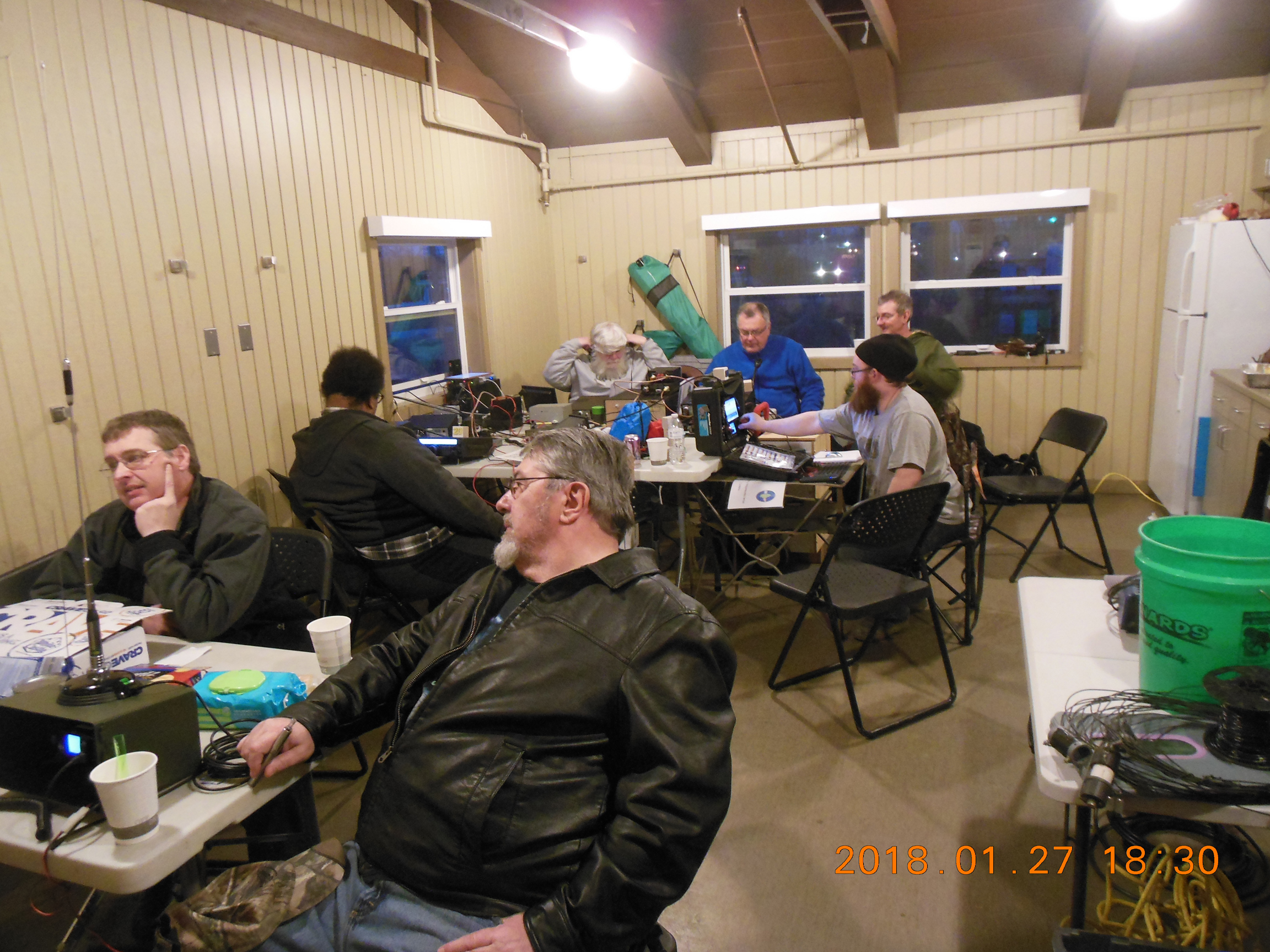 Collective hubbub in the kitchen area.
