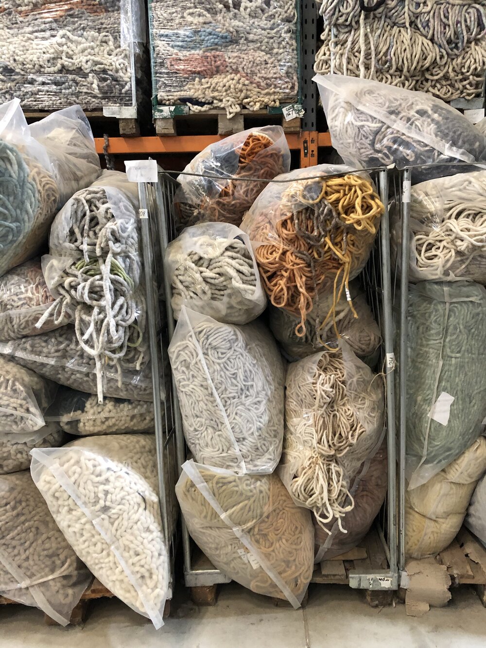 Wool that has been cleaned and prepared, waiting to go to a weaver.