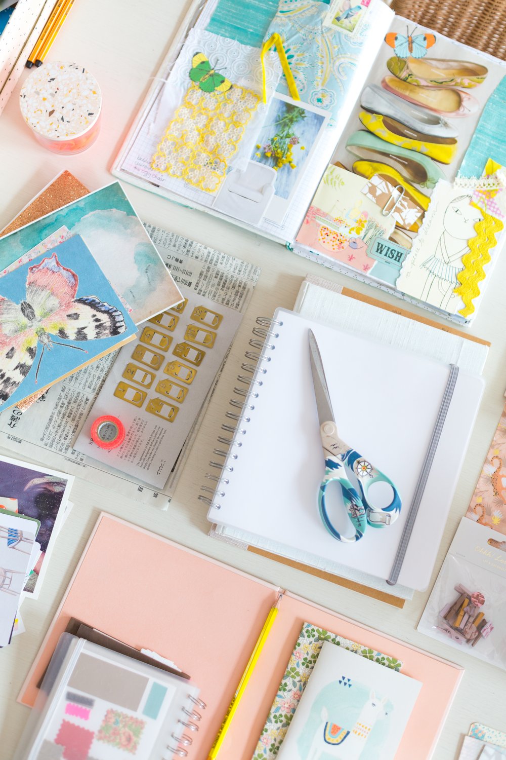 an aesthetic flat lay of junk journaling supplies gathered on top