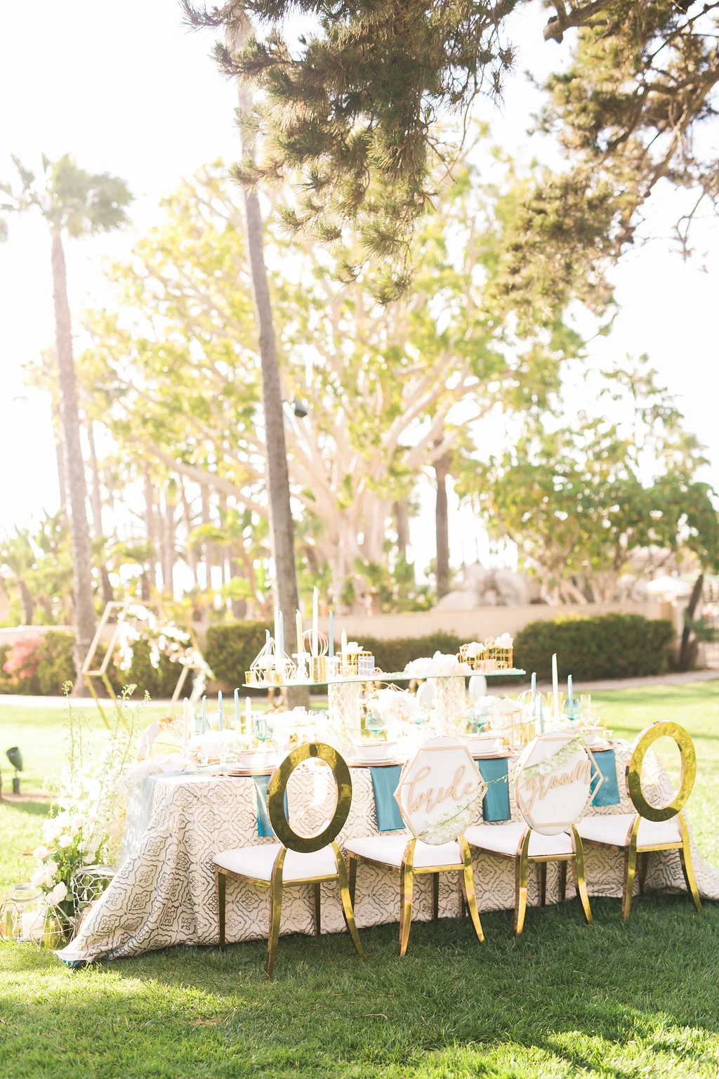 The reception table came together nicely with layers of pattern, reflective glass and copper details, geometric accents, table number and bride and groom chair signs. So much prettiness in one place! And how awesome are the chairs? Rose gold with white leather, what's not to love?
