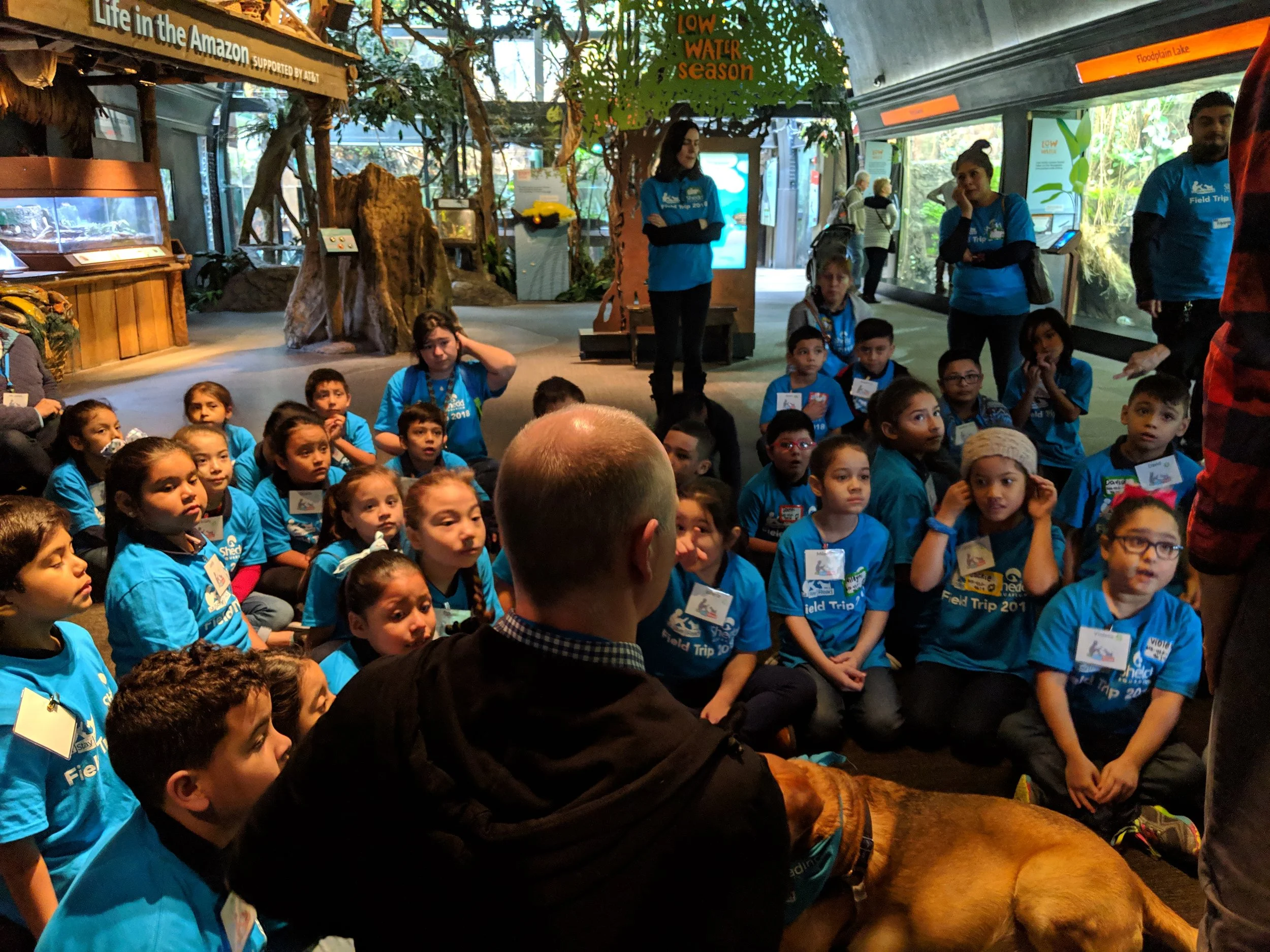 Students listen to Mr. Max, the Shedd Aquarium’s Program Leader, for instructions about their activity.