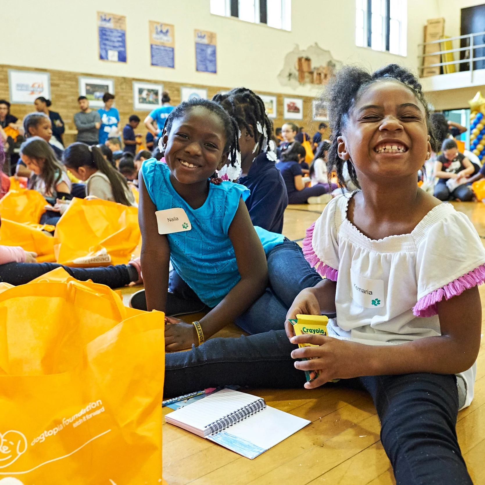 SitStayRead students opening up their Summer Reading Fun Packs at the Keep Reading Celebration at Marquette Elementary ( A. Mandel )