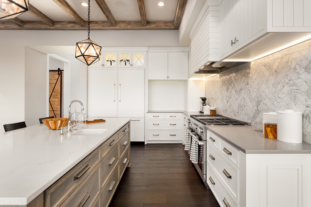 Wide Engineered Hardwood Floors and Marble Tile Herringbone Backsplash Installed in a Kitchen (Medium Size).jpg