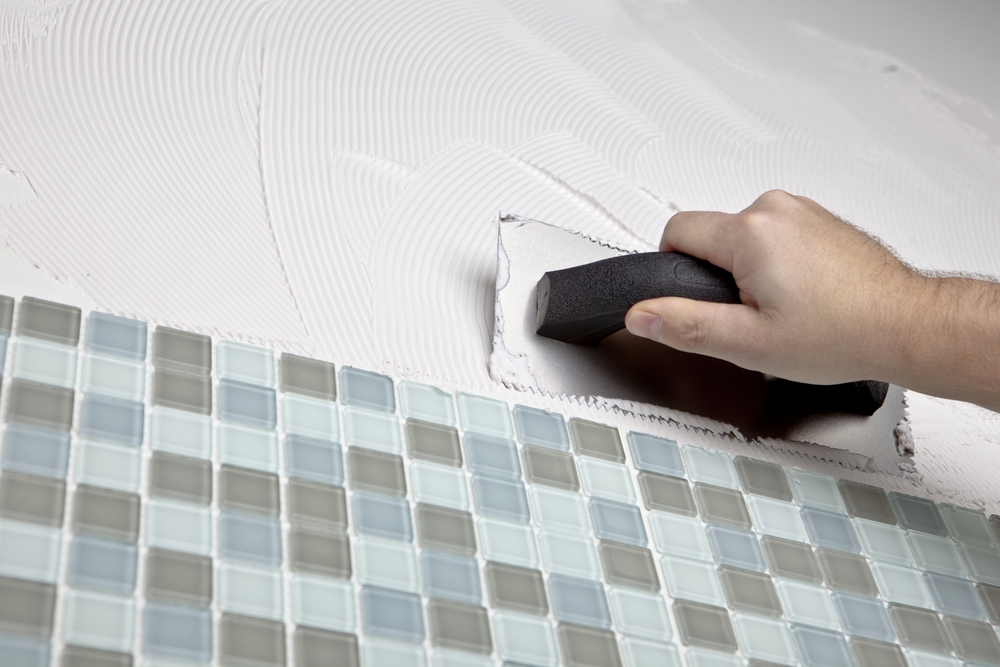 Installer Applying Thinset Next to Glass Mosaic Tile (Medium Size).jpg