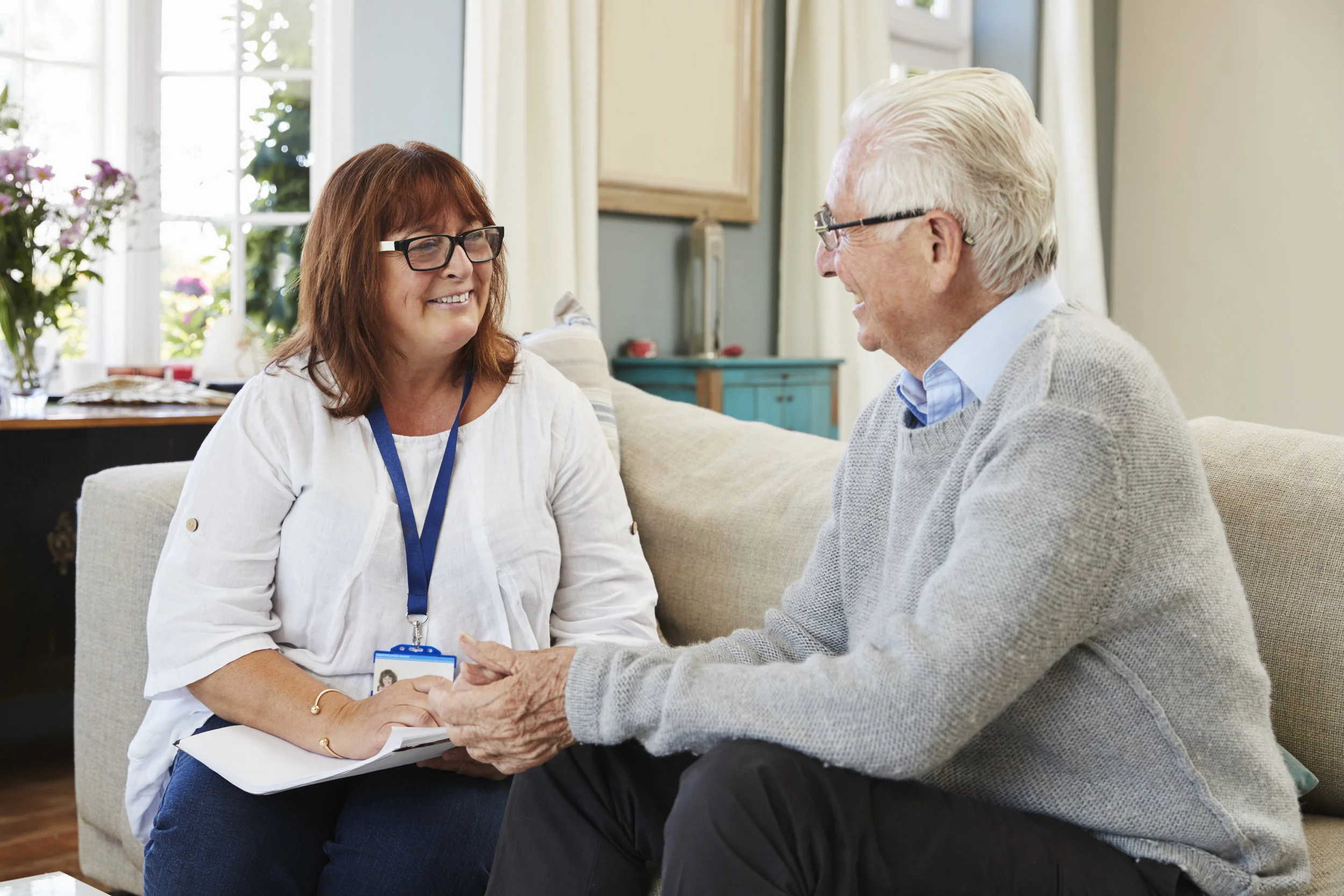female-support-worker-visits-senior-man-at-home-PQPXTEL.jpg