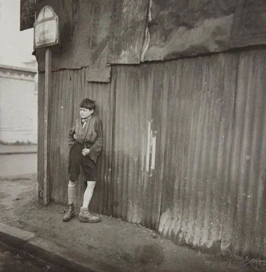 Dora Maar, Gamin aux Chaussures Dépareillés, 1933, vintage gelatin silver print, 11 x 11 inches