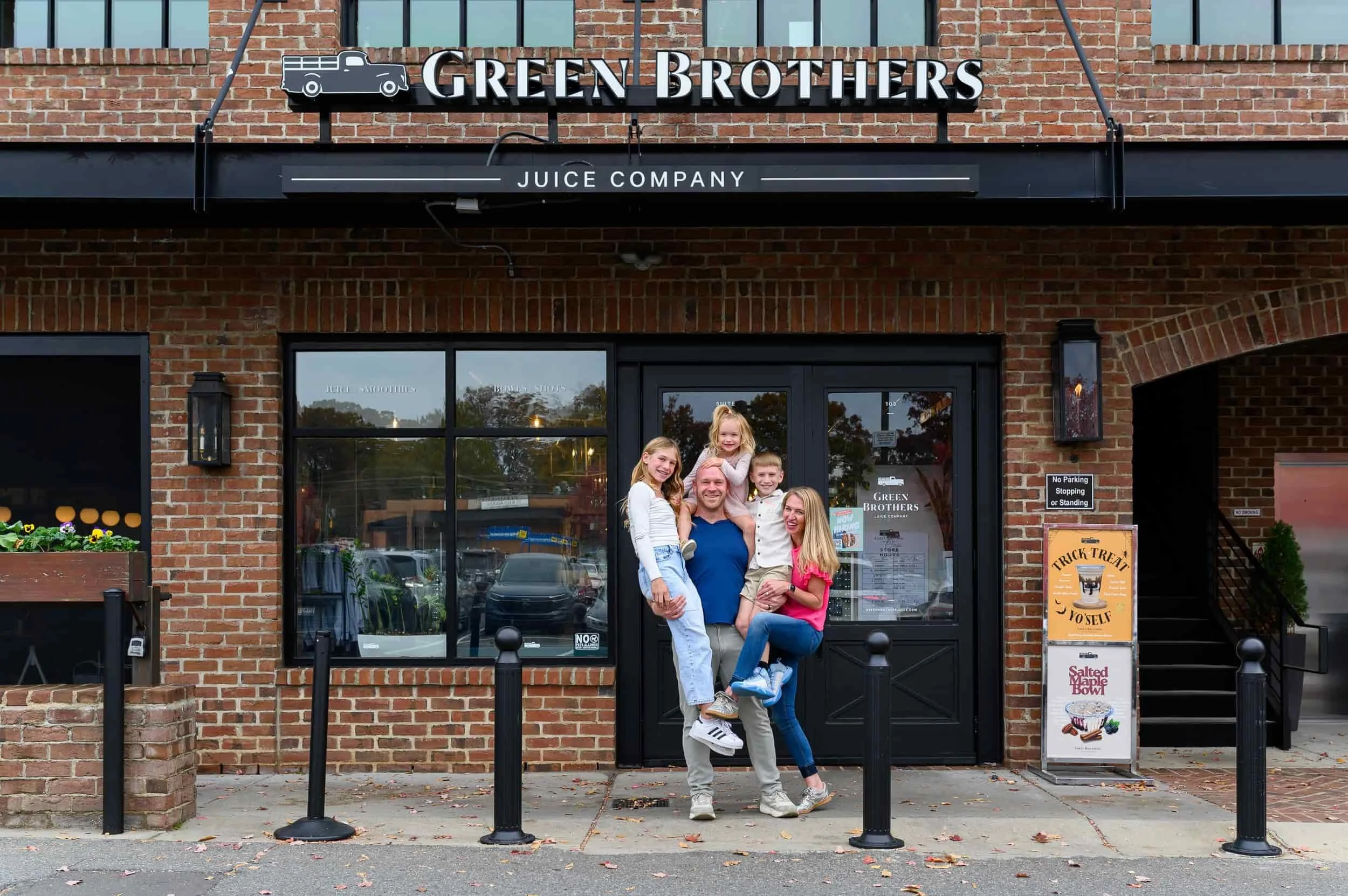 Family in front of business in Dilworth