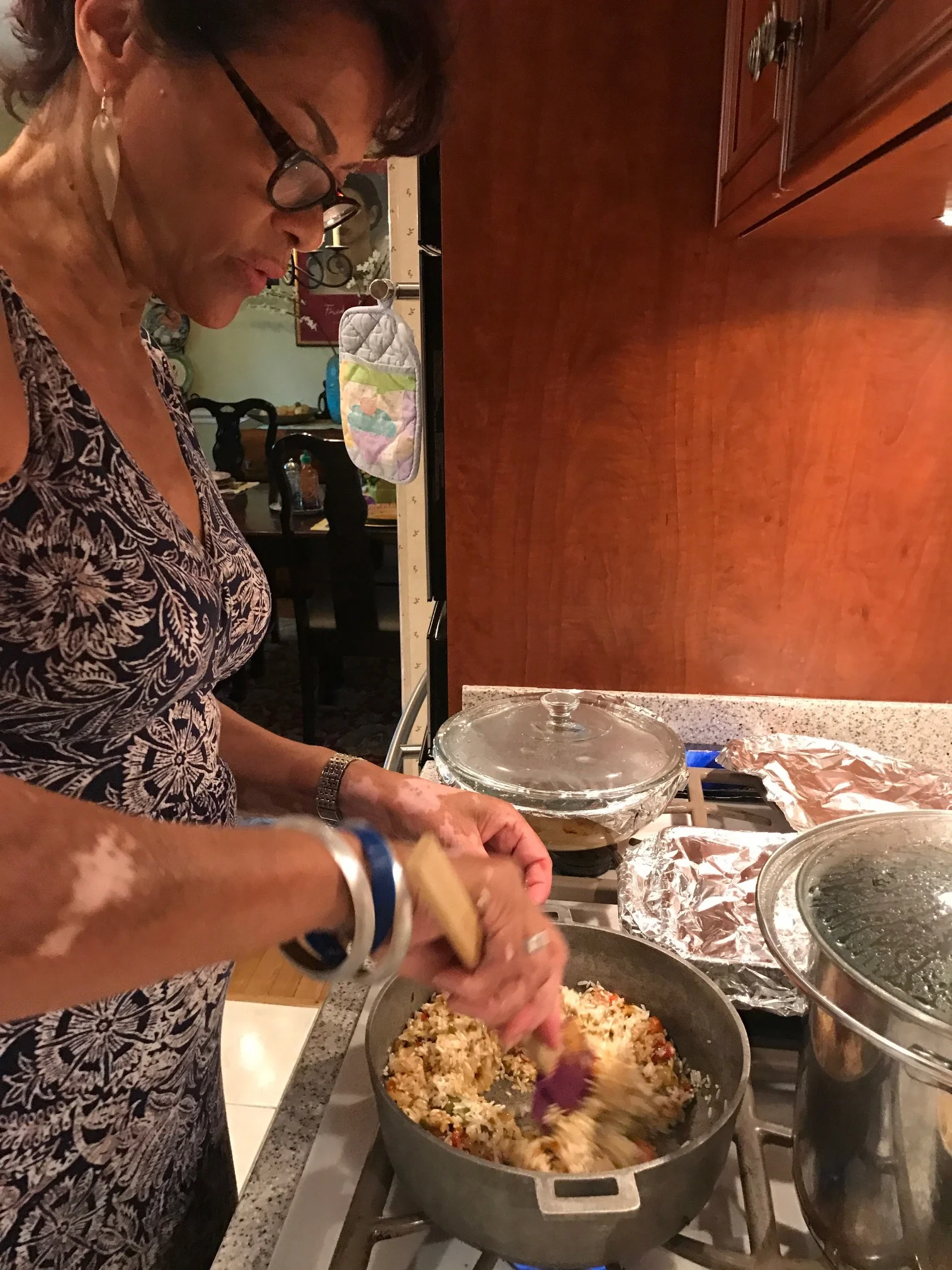 Ita stirring the rice and Sazon together