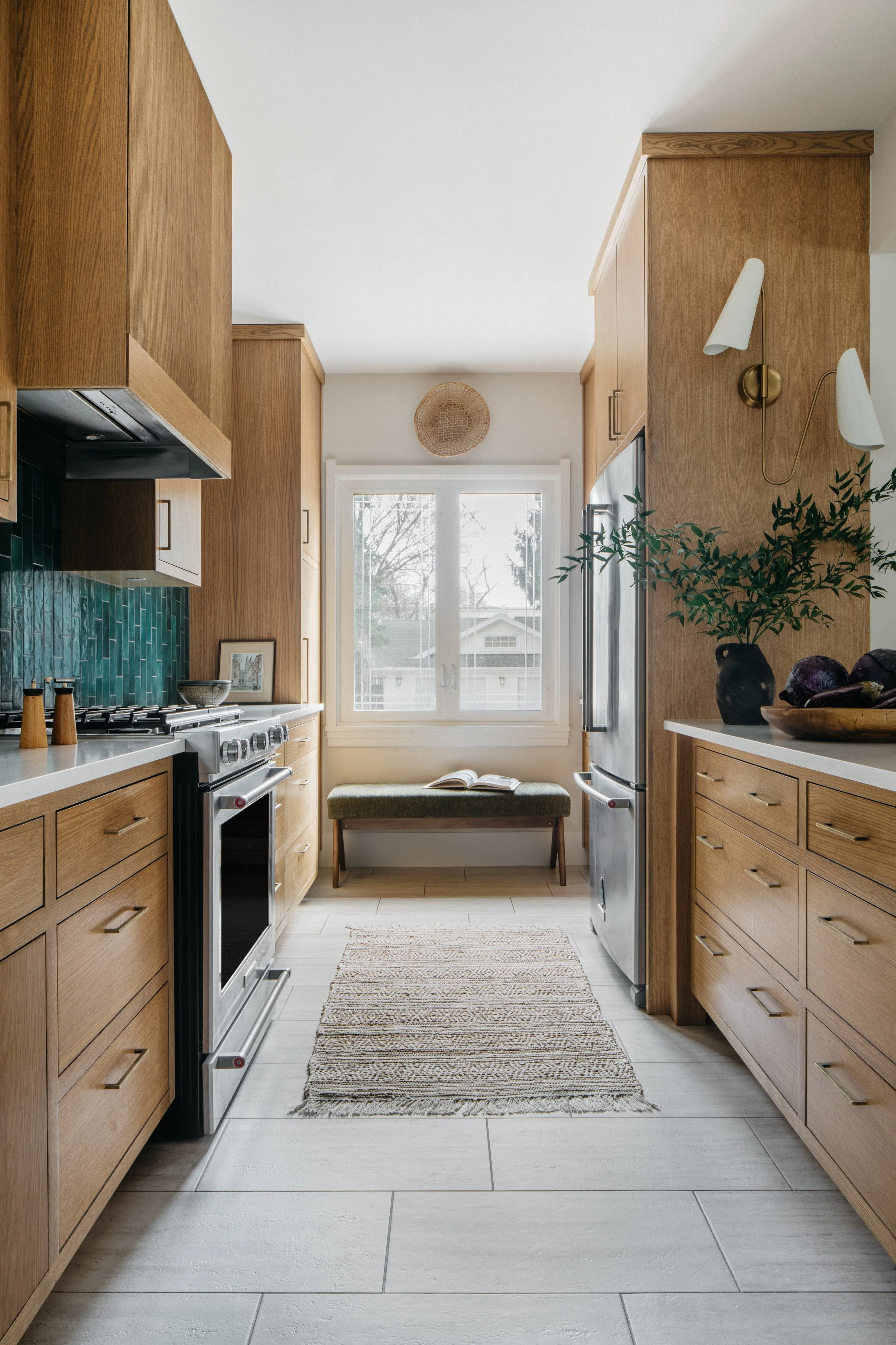 Traditional Kitchen in River Forest with green tile, white oak cabinets, white marble counter tops, modern lighting, and brass fixtures 