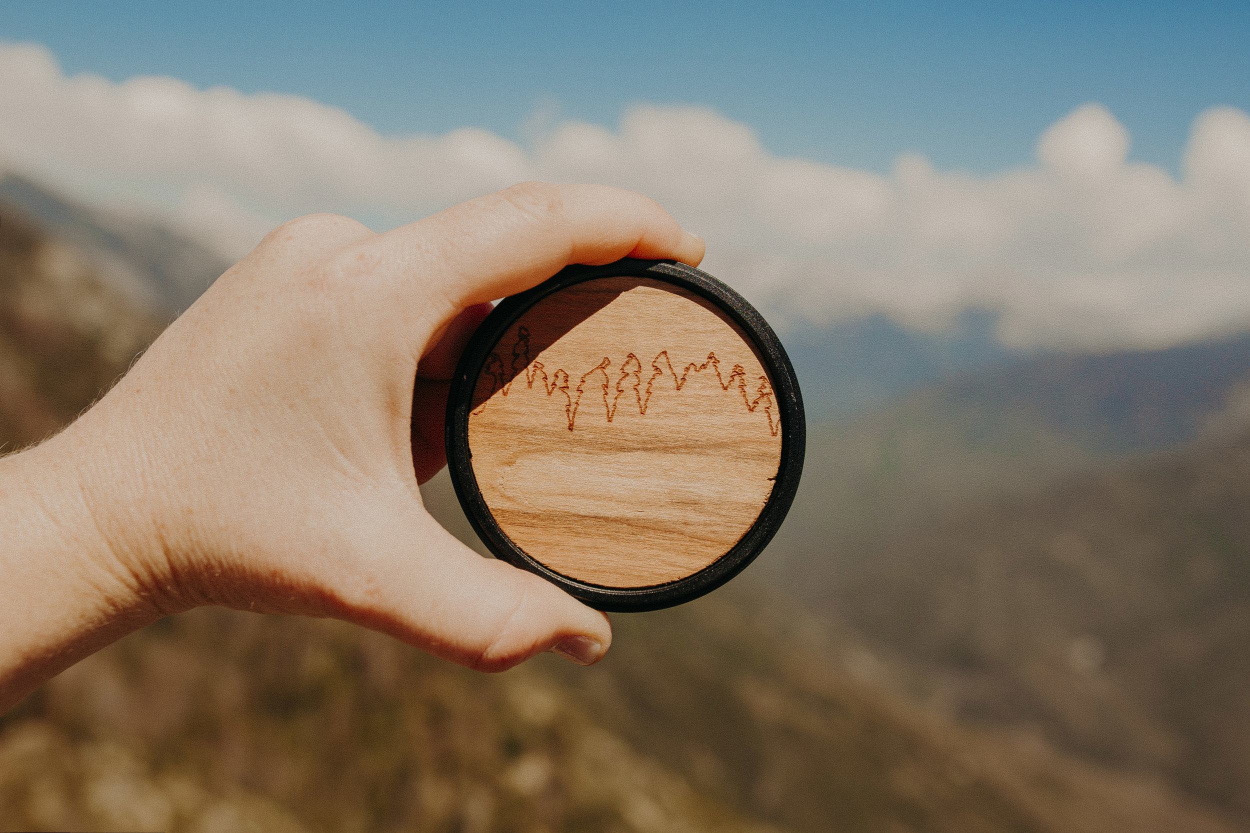  By far, the best lens cap out there! Snag your  wood lens cap here ! 