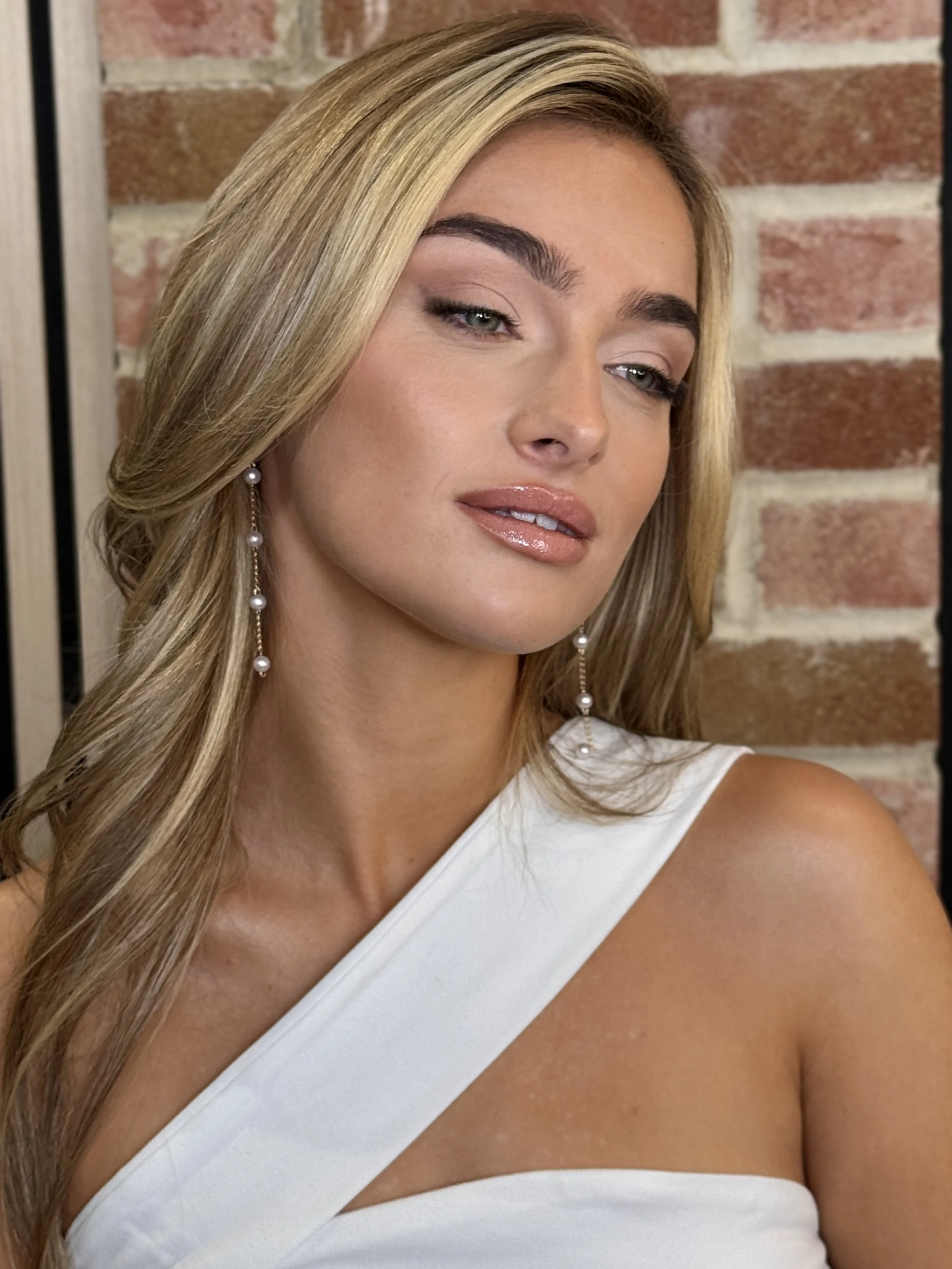 Bride with a natural matte cool-toned bridal makeup look featuring smooth, shine-free skin, softly defined eyes, and a subtle lip, professionally applied by Katie of KMS Brows & Beauty for an elegant, long-lasting wedding finish