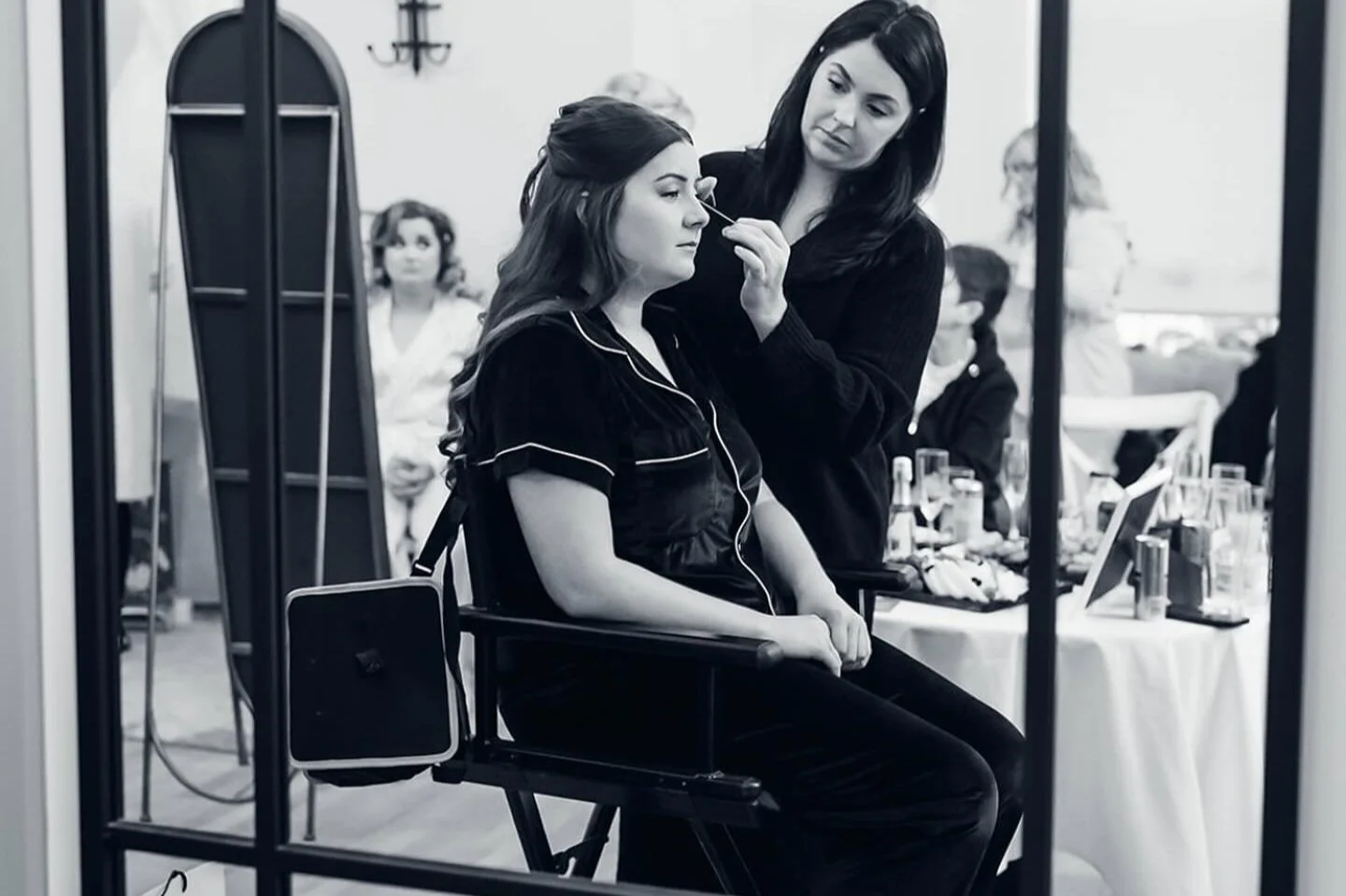 Katie of KMS Brows & Beauty applying bridal makeup to a bride on her wedding morning, showcasing professional bridal makeup services available to book for weddings and special occasions.