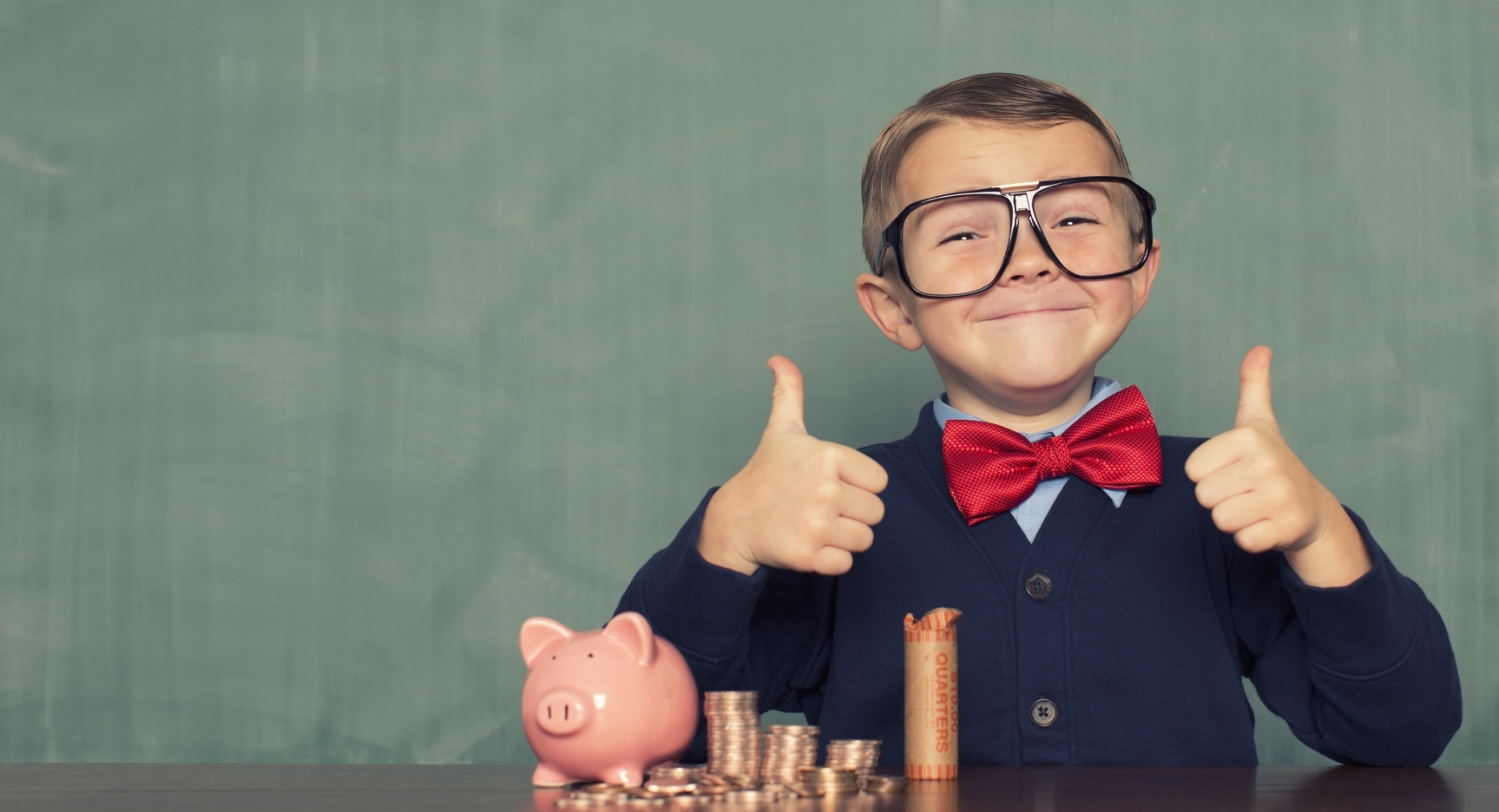 Young-Boy-Nerd-Saves-Money-in-His-Piggy-Bank-482805813_2122x1415.jpeg