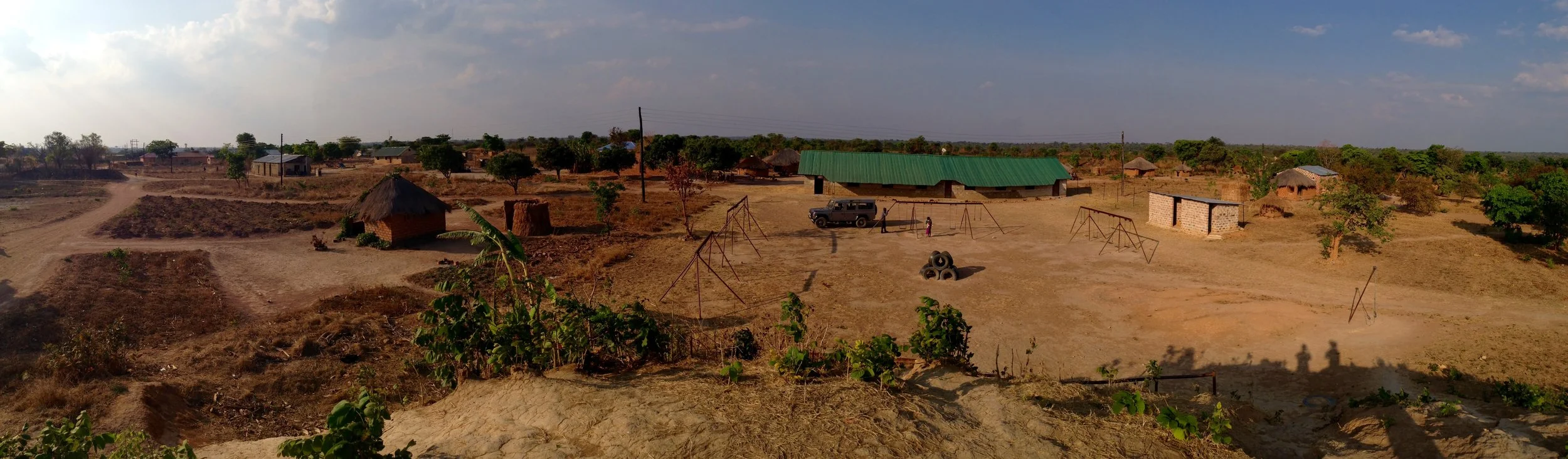panorama of the procured property. the green roof is the main classroom block already in use.