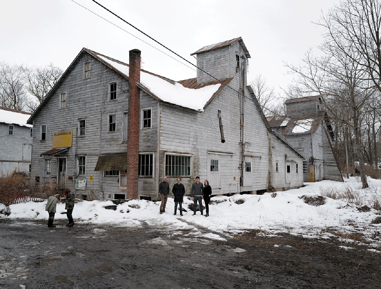 Exterior winter view of the Anderson feed mill complex in Accord, New York. Snow dusts the ground during a site visit by The Oberon Group.