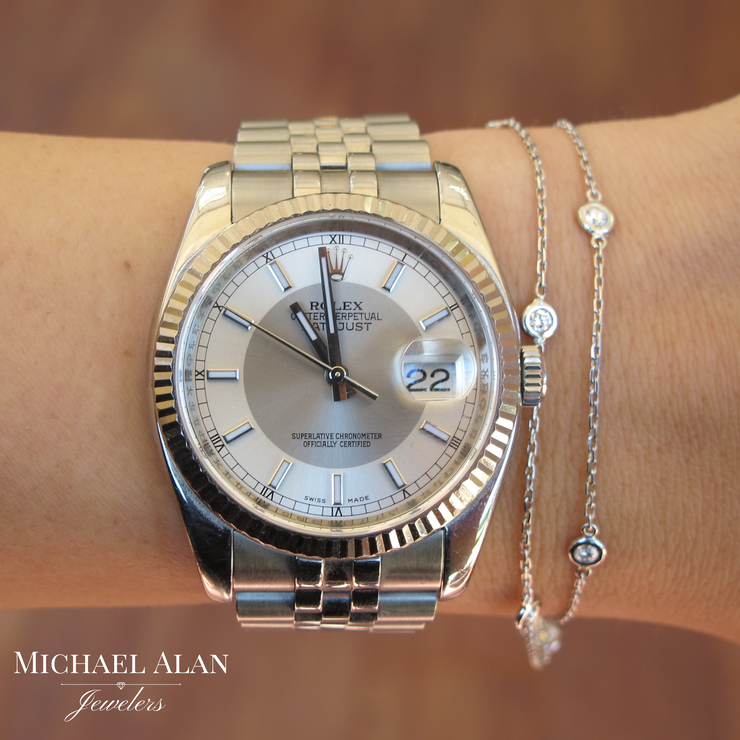 14K white gold diamond bezel bracelet with 7 round brilliant cut diamonds at .50 carat total weight.