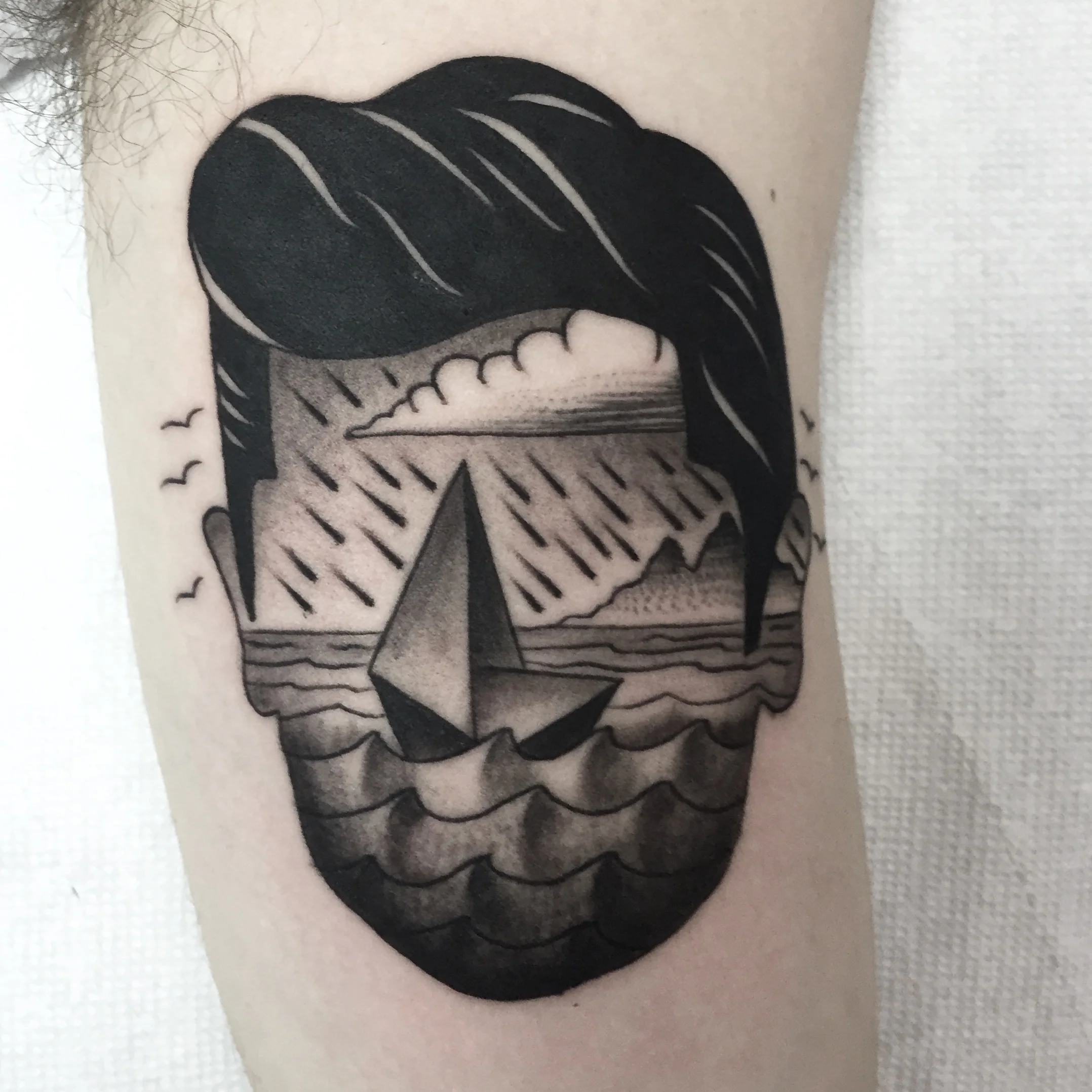  Surreal new-traditional blackwork scene within dapper gent head 