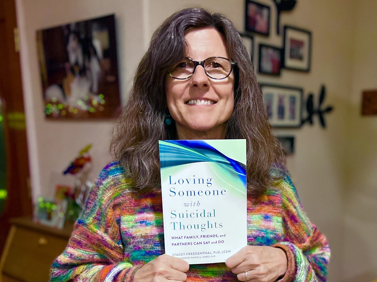 Photo Stacey Freedenthal WITH BOOK (1).png