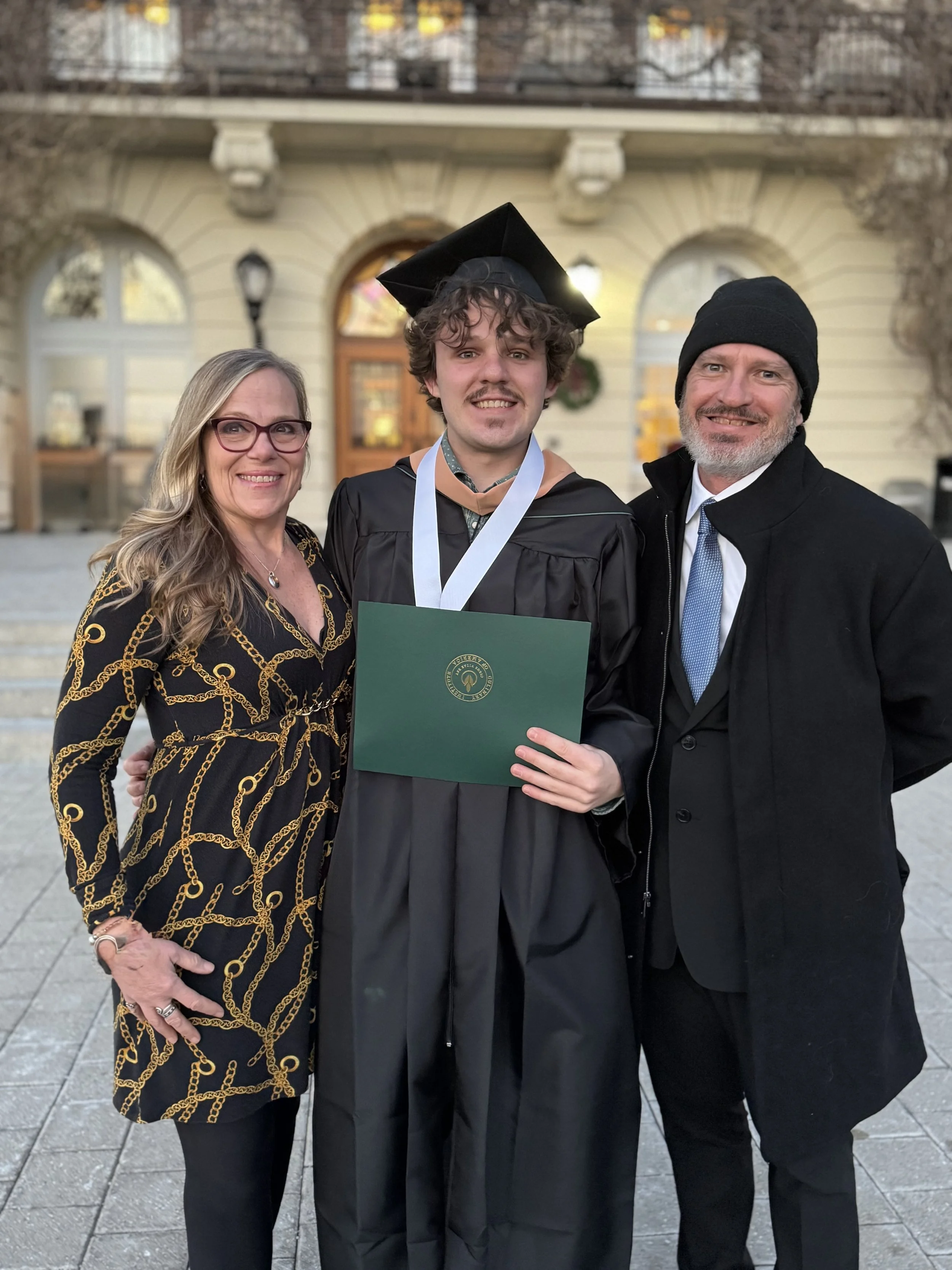 Jax Graduates with M&D.jpg