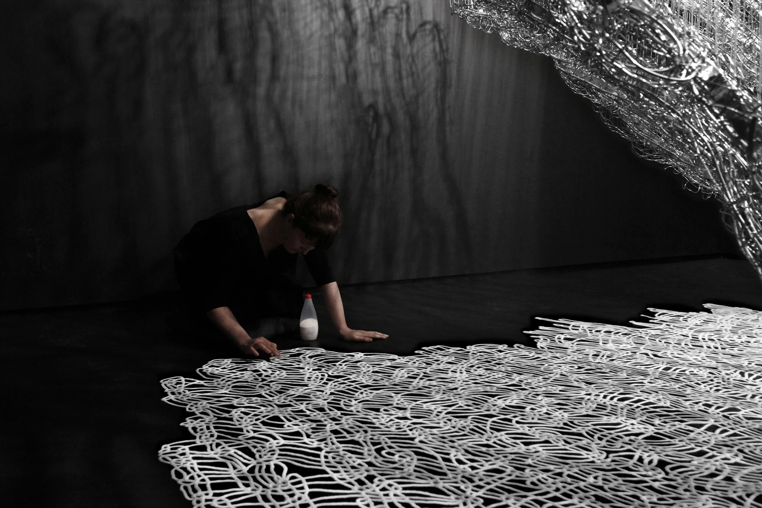 Australian artist Hannah Quinlivan creating a salt drawing.
