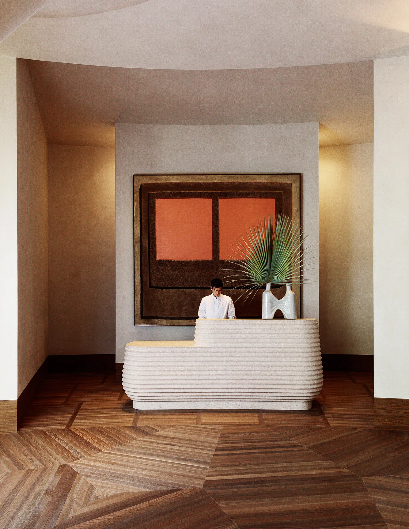 The art-filled lobby provides a relaxed meeting point for guests and locals.