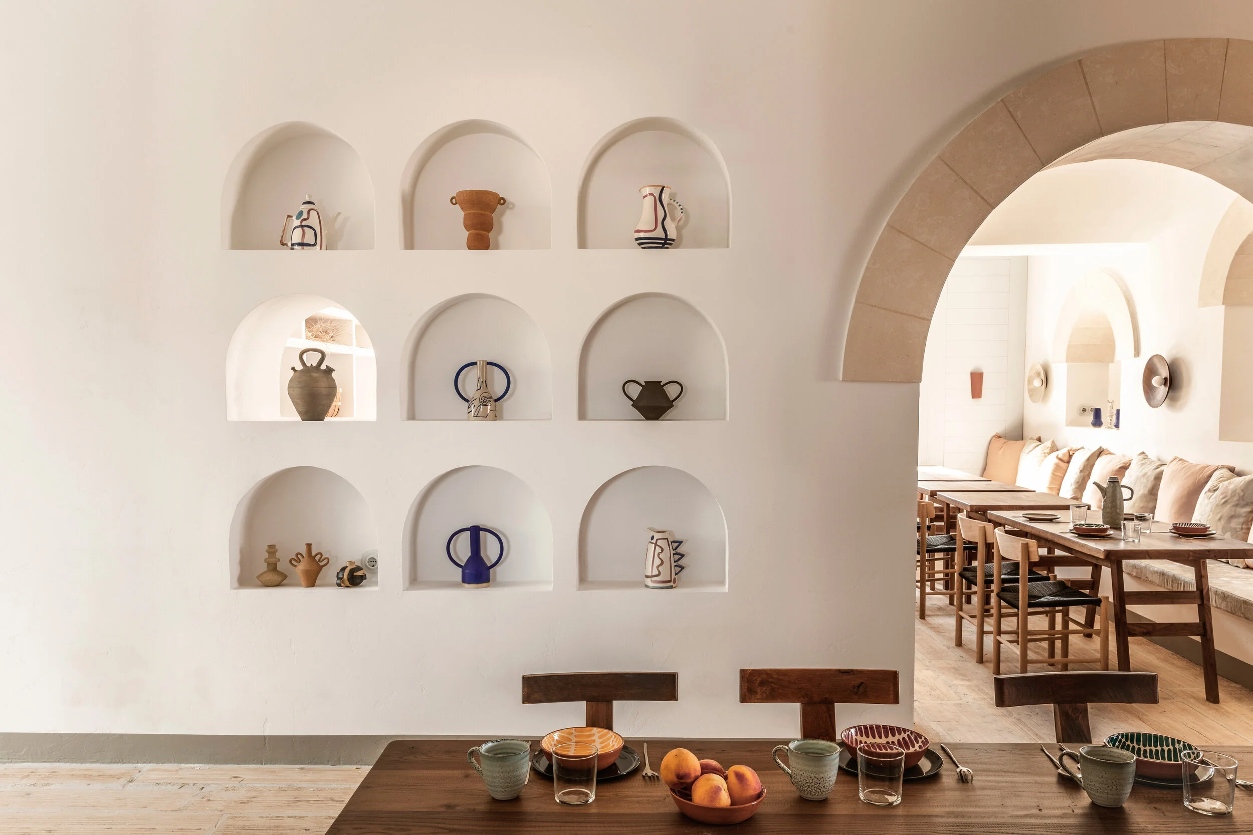 The hotel brings together art and sculpture that can be found across the laid-back Mediterranean Island in bright pops of blues, reds, and terracotta oranges.