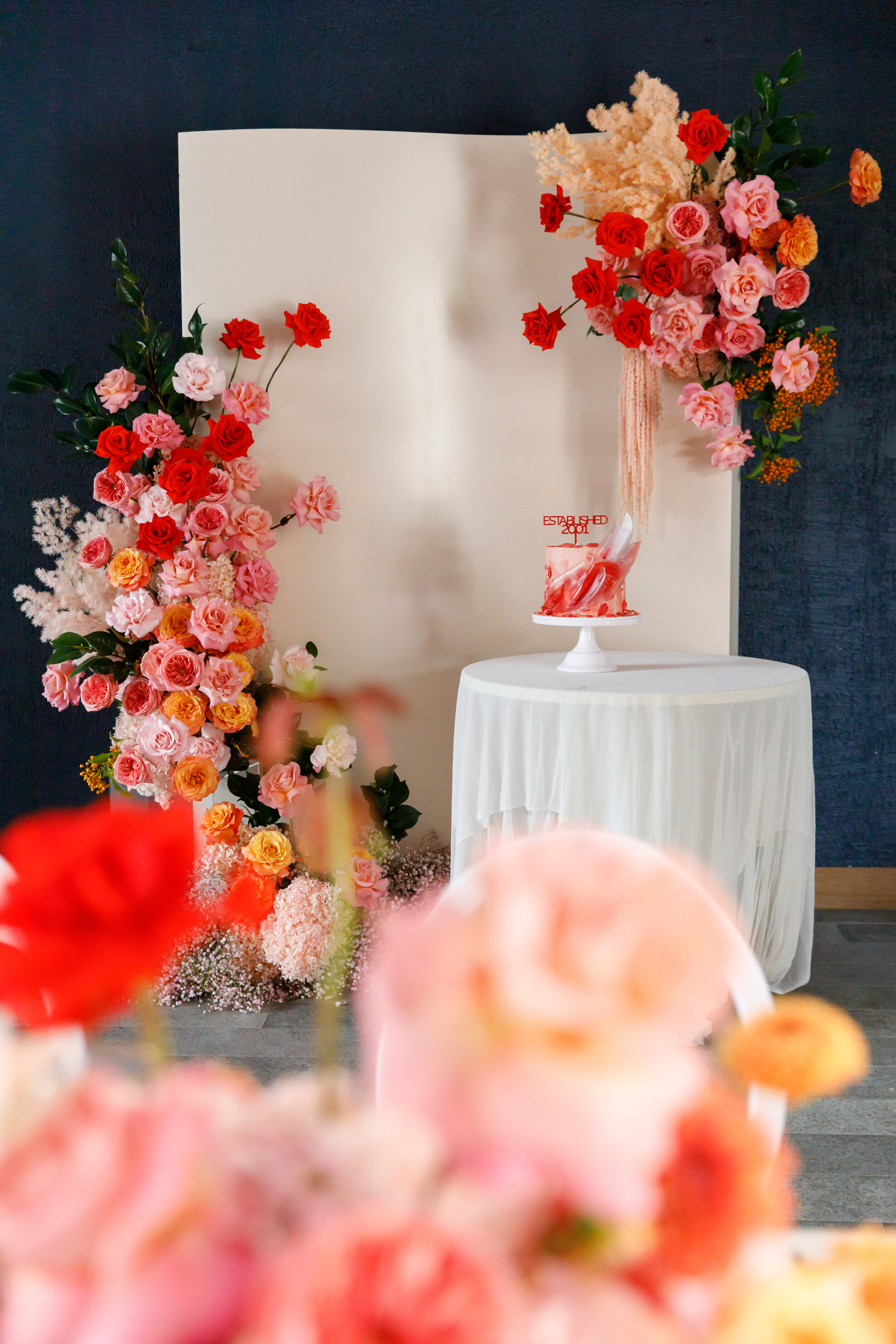 peachy pink  orange and red flowers  styling backdrop events florist sydney