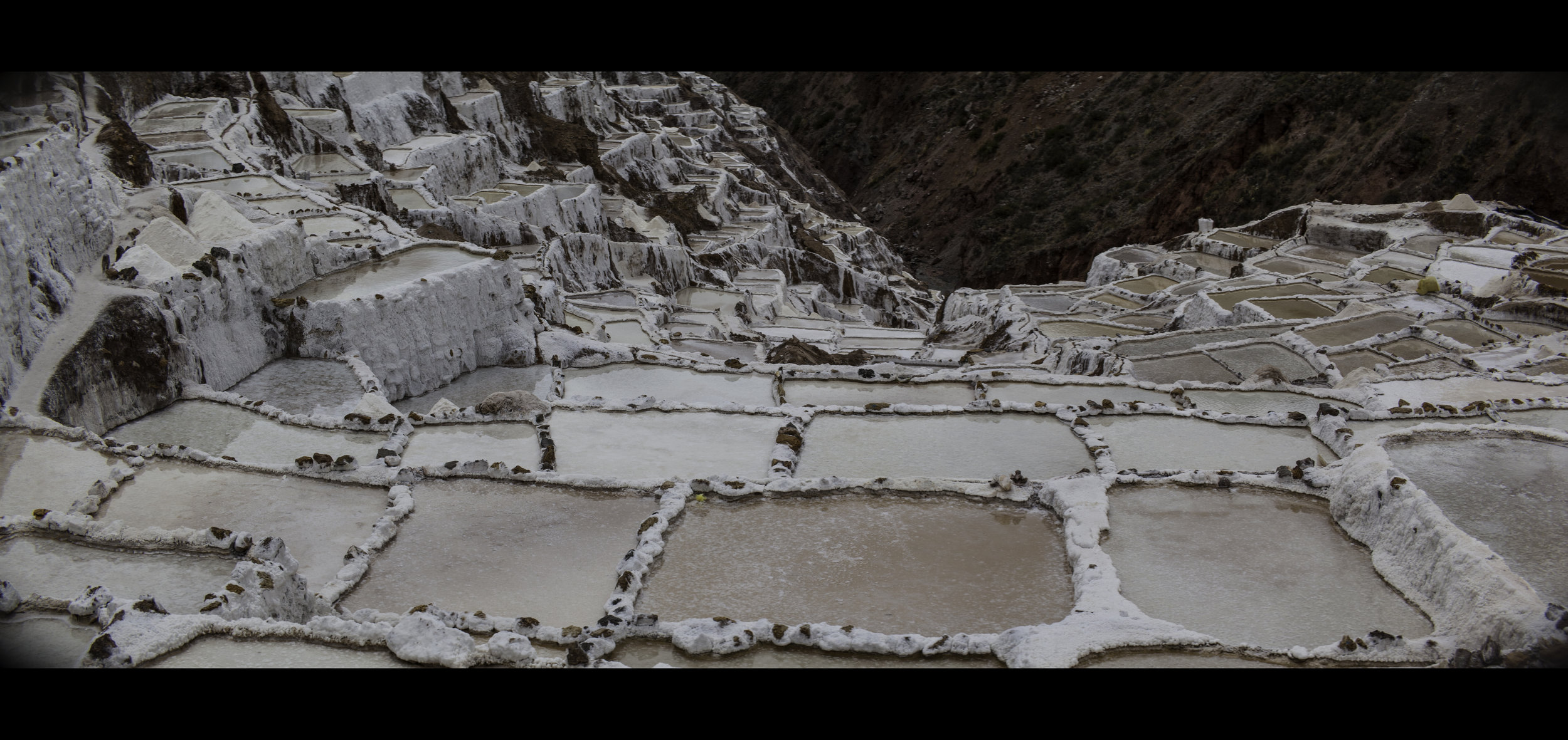 Anamorphic Photograph of the Salt Mines in Maras, Peru.