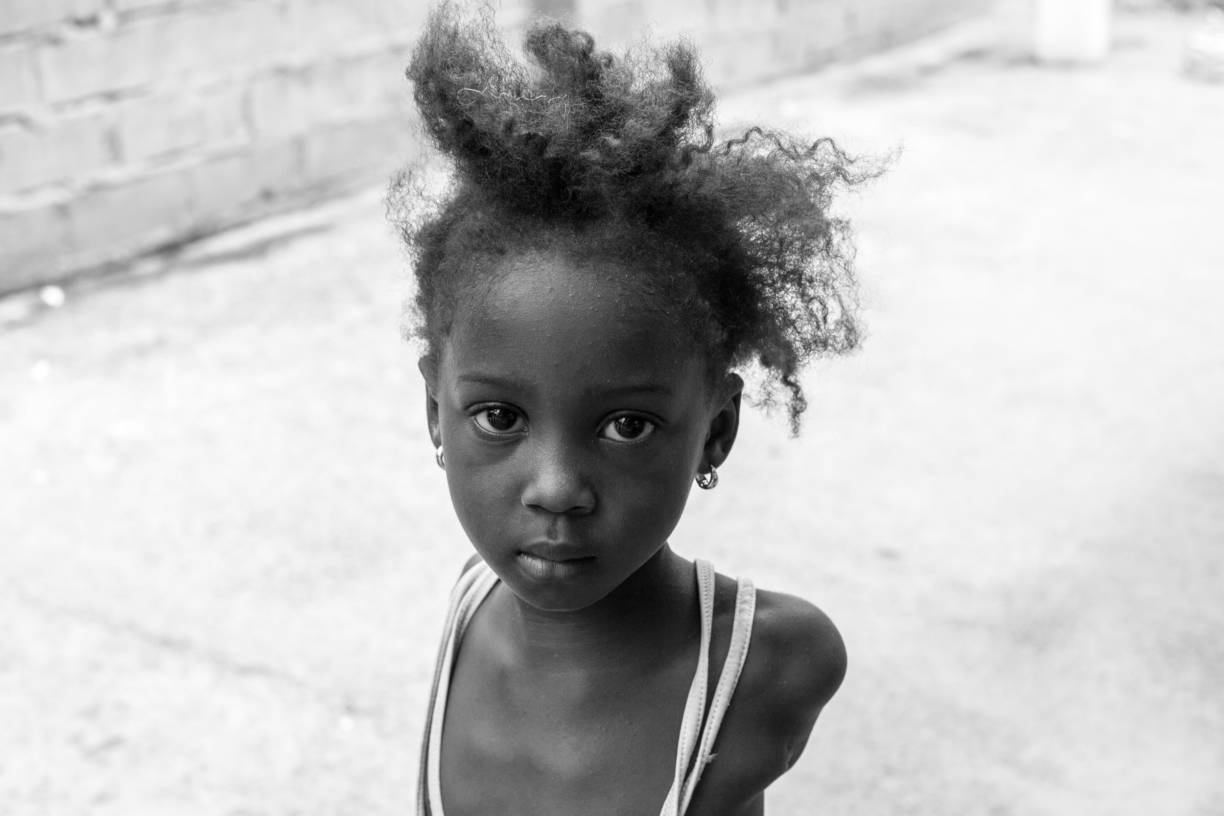 A beautiful black and white portrait of a young girl in Gambia.