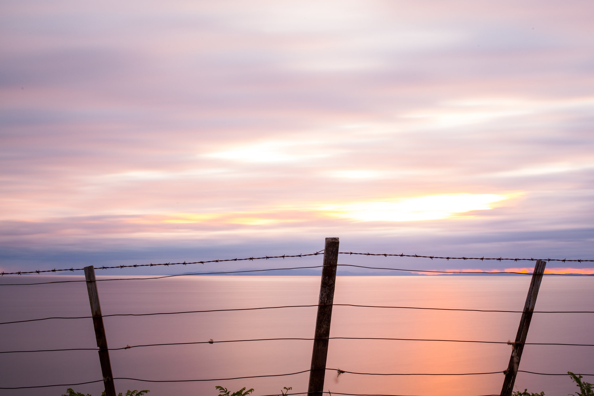 Sunset, Sea, barbed wire, Scotland.