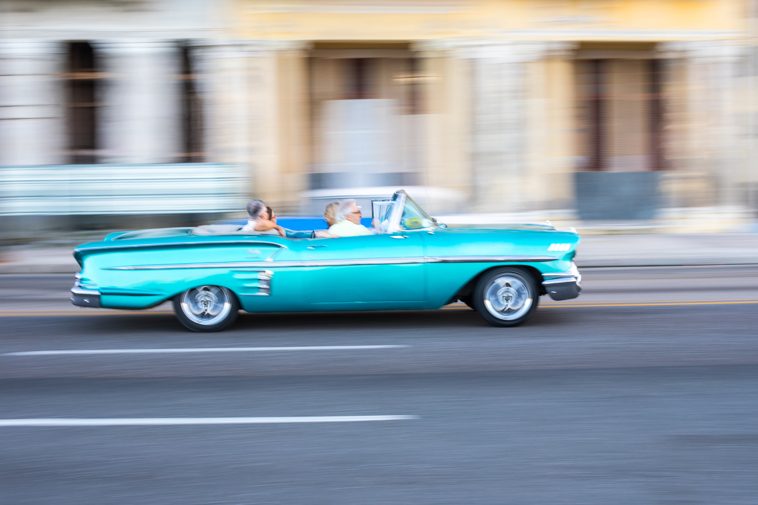 A classic car drives past in La Habana, the capital of Cuba.