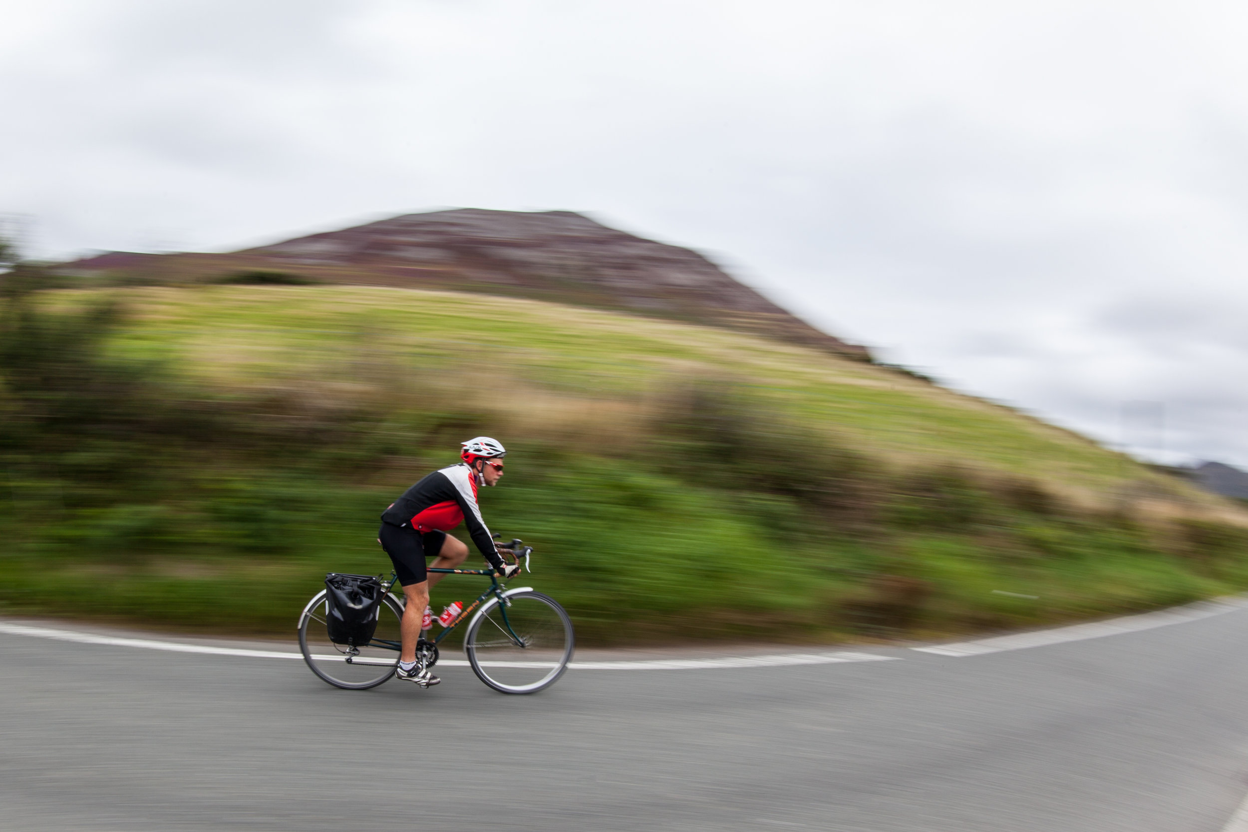 James Cope speeds by on his bicycle in North Wales on the Countrywide Great Tour.