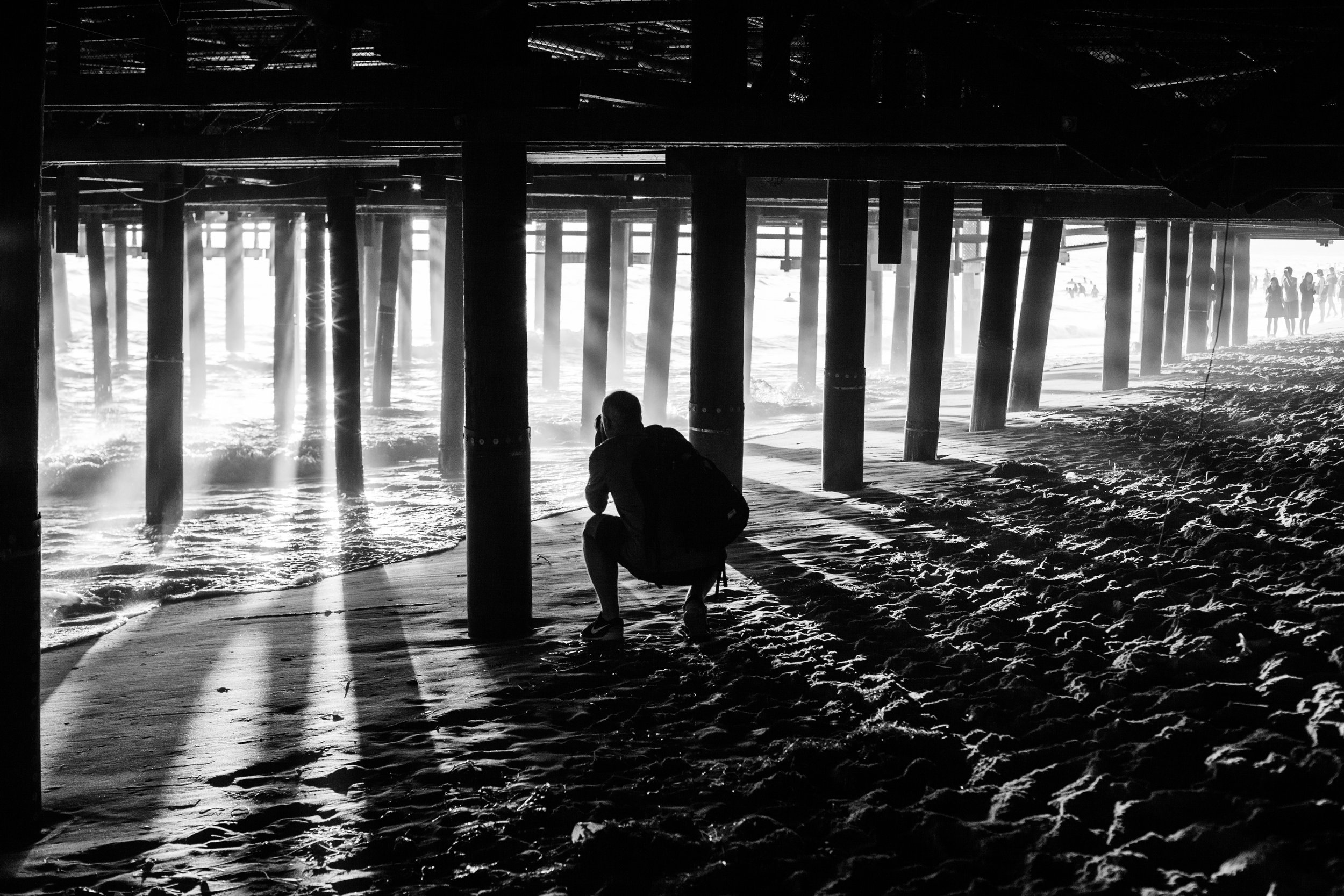 The light under Santa Monica Pier, California by Geraint Rowland.