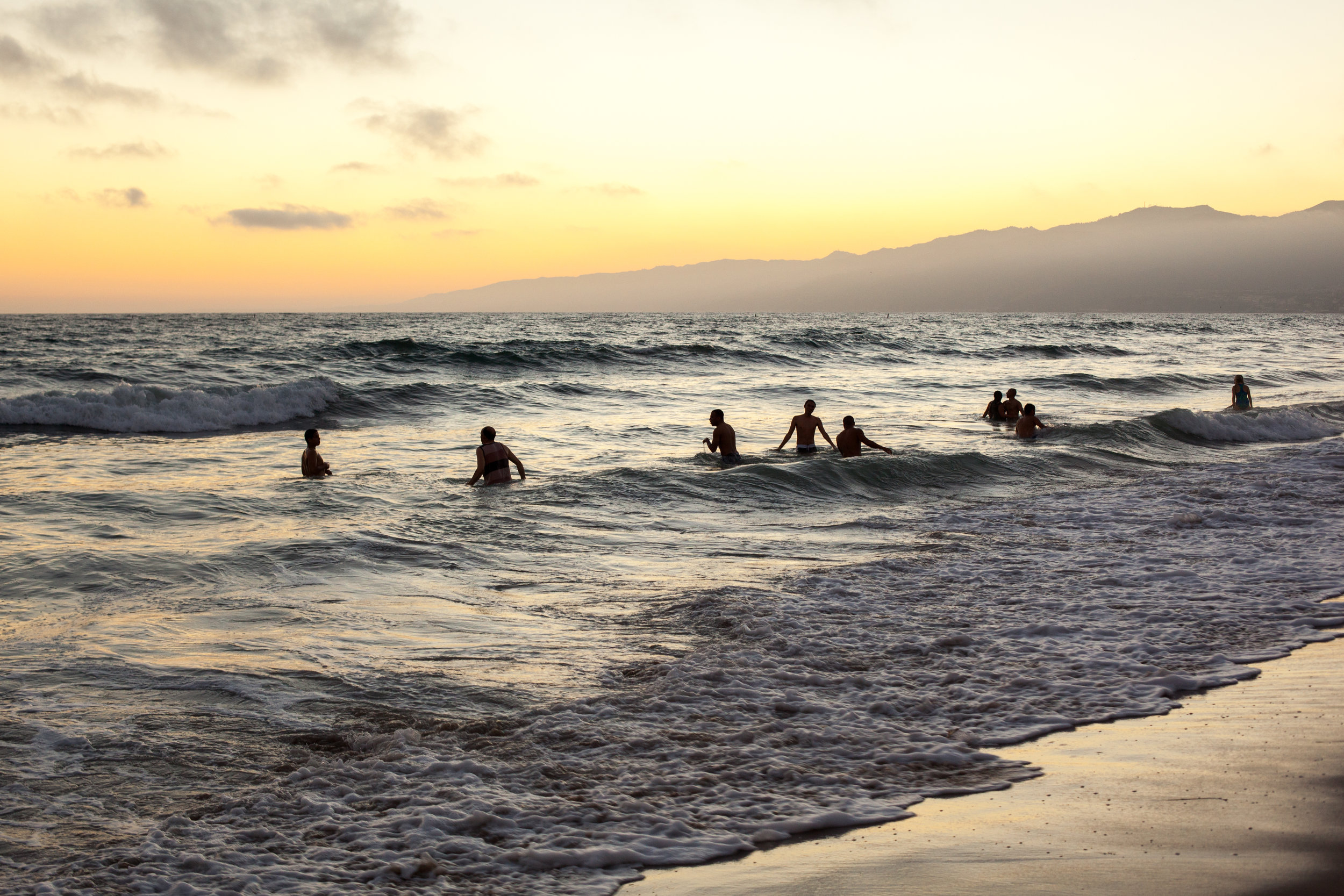 Swimming at sunset at Santa Monica Beach.