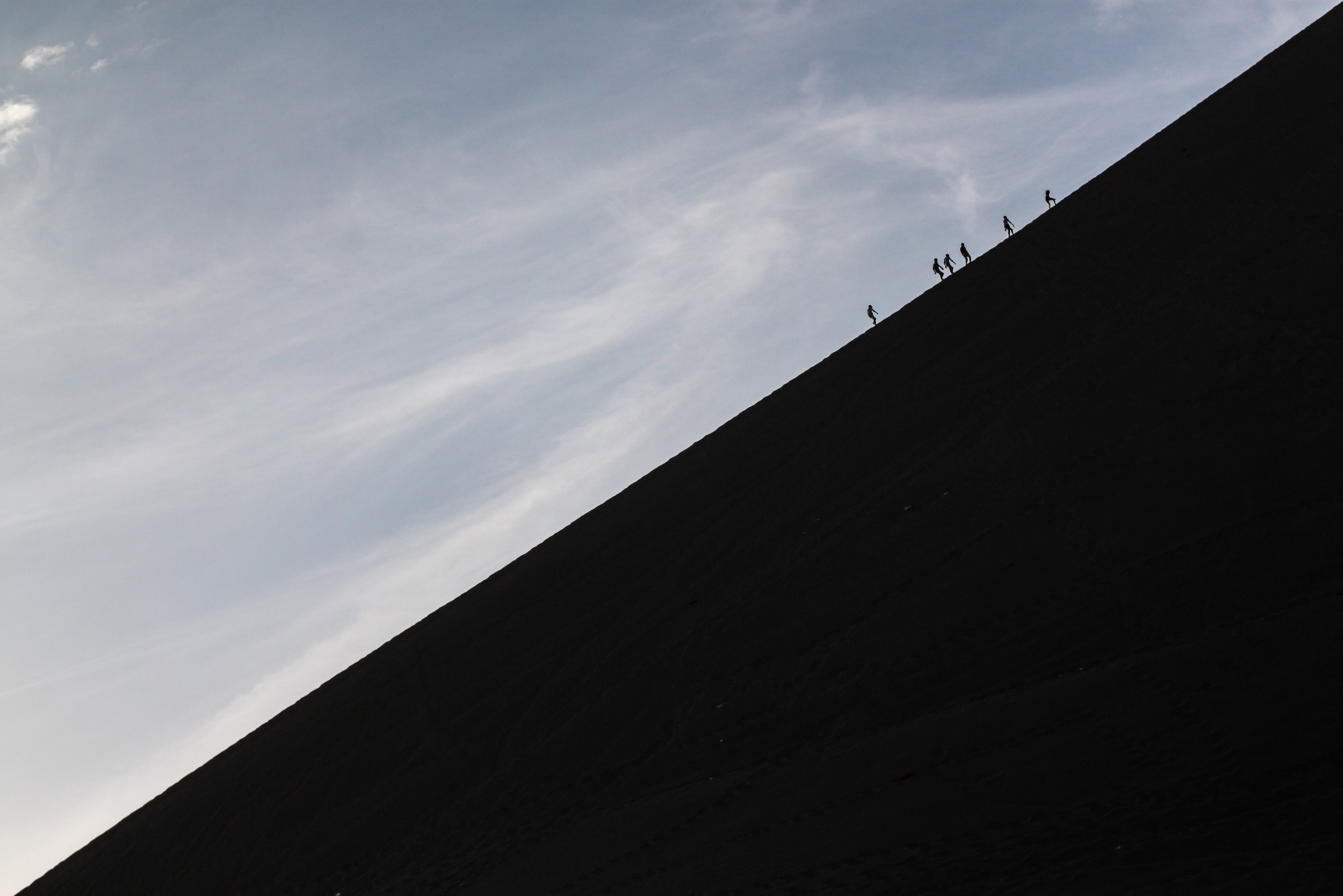 Heavy use of negative space and minimalism add to the scale of this photo in Huacachina, Ica, Peru.