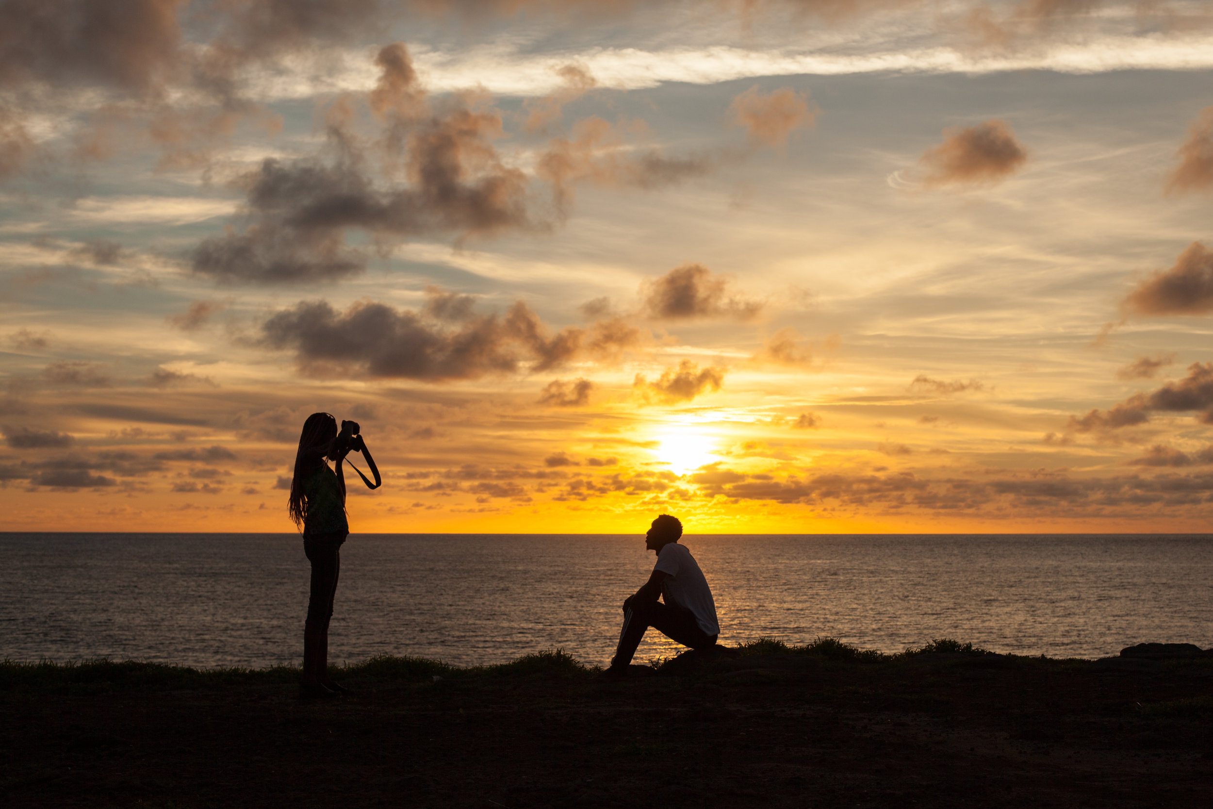 A photo shoot takes place at sunset on Ngor island in Senegal.