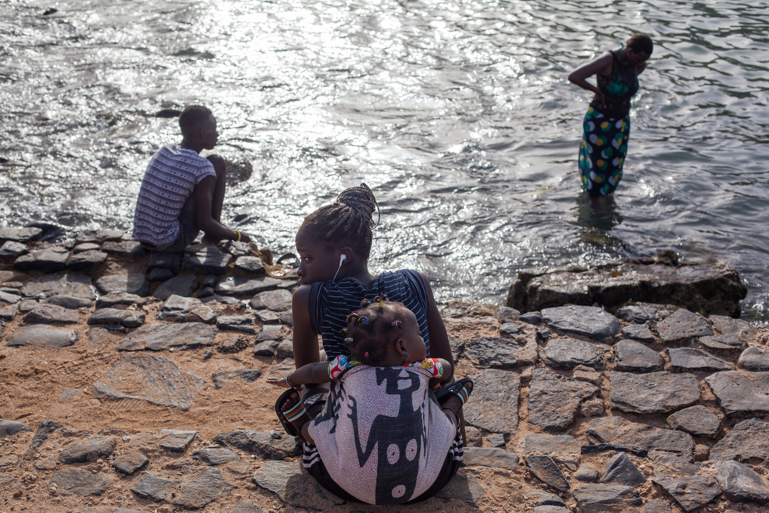 Candid portrait of Mother and Baby on Gorée island in Dakar, Senegal.