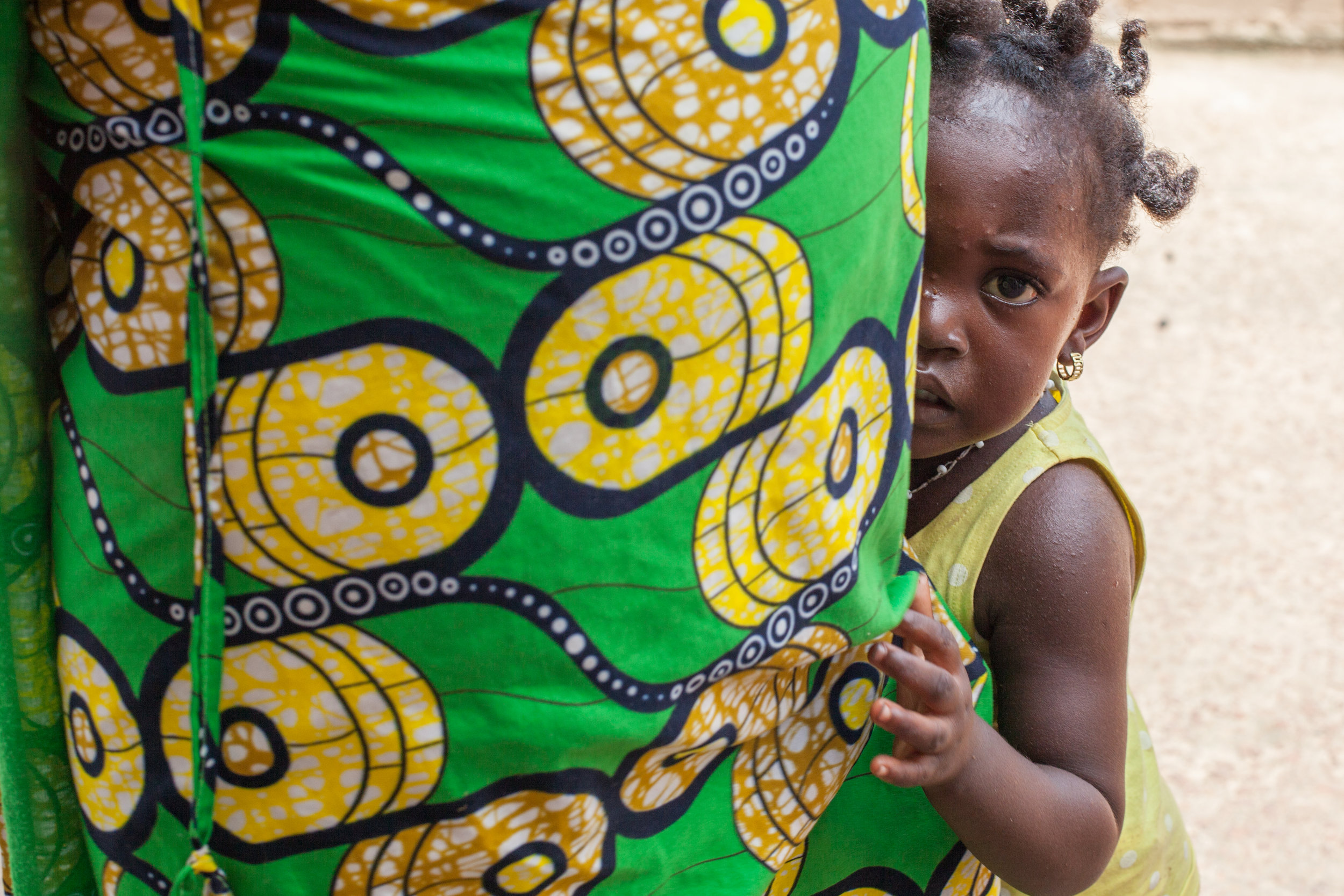 Camera shy child in The Gambia.