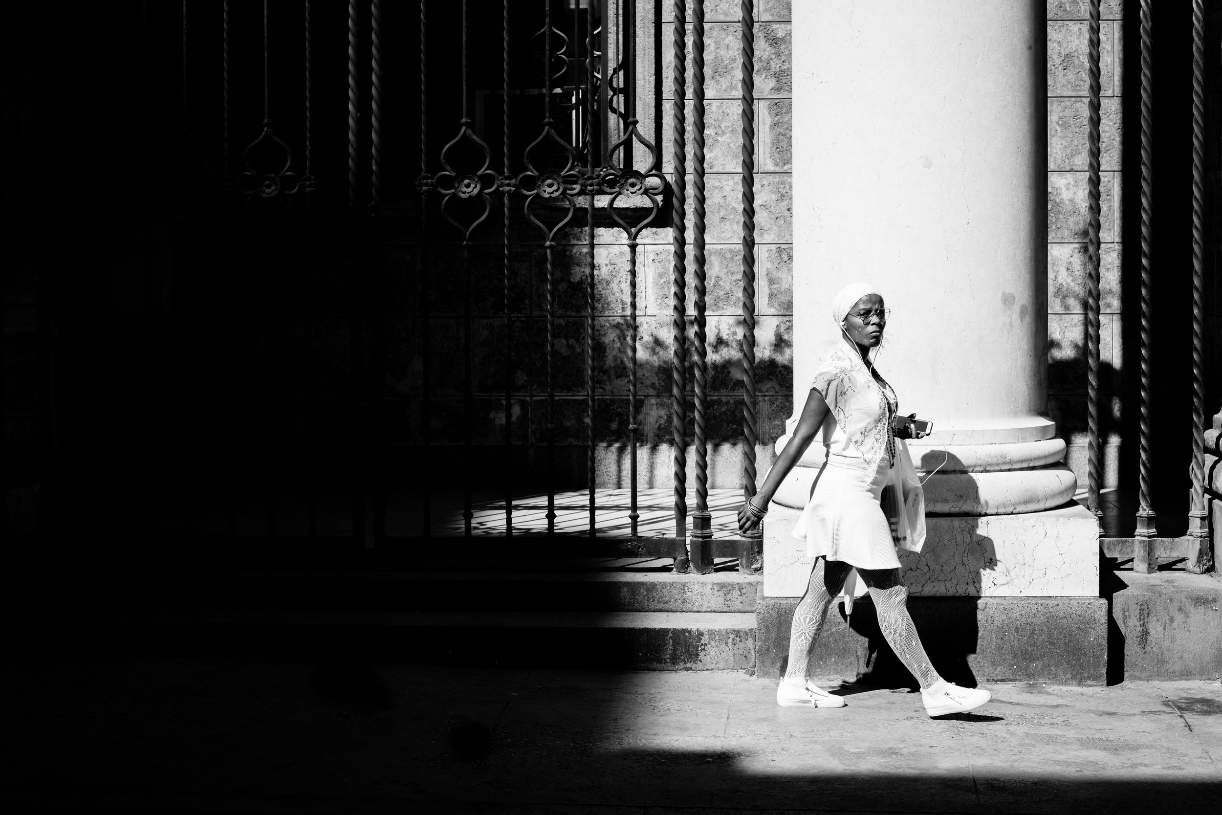 Ffotogallery Platform Instagram Takeover by Geraint Rowland - A Cuban Lady dressed as a Santeria walks through the streets of Havana.