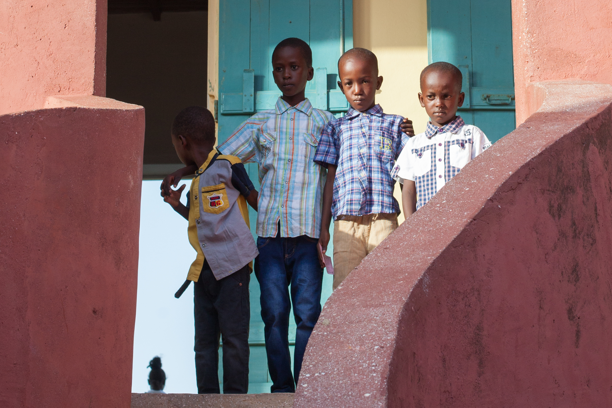 African children stand in front of the slave house on the Island of Gorée, Dakar, Senegal.