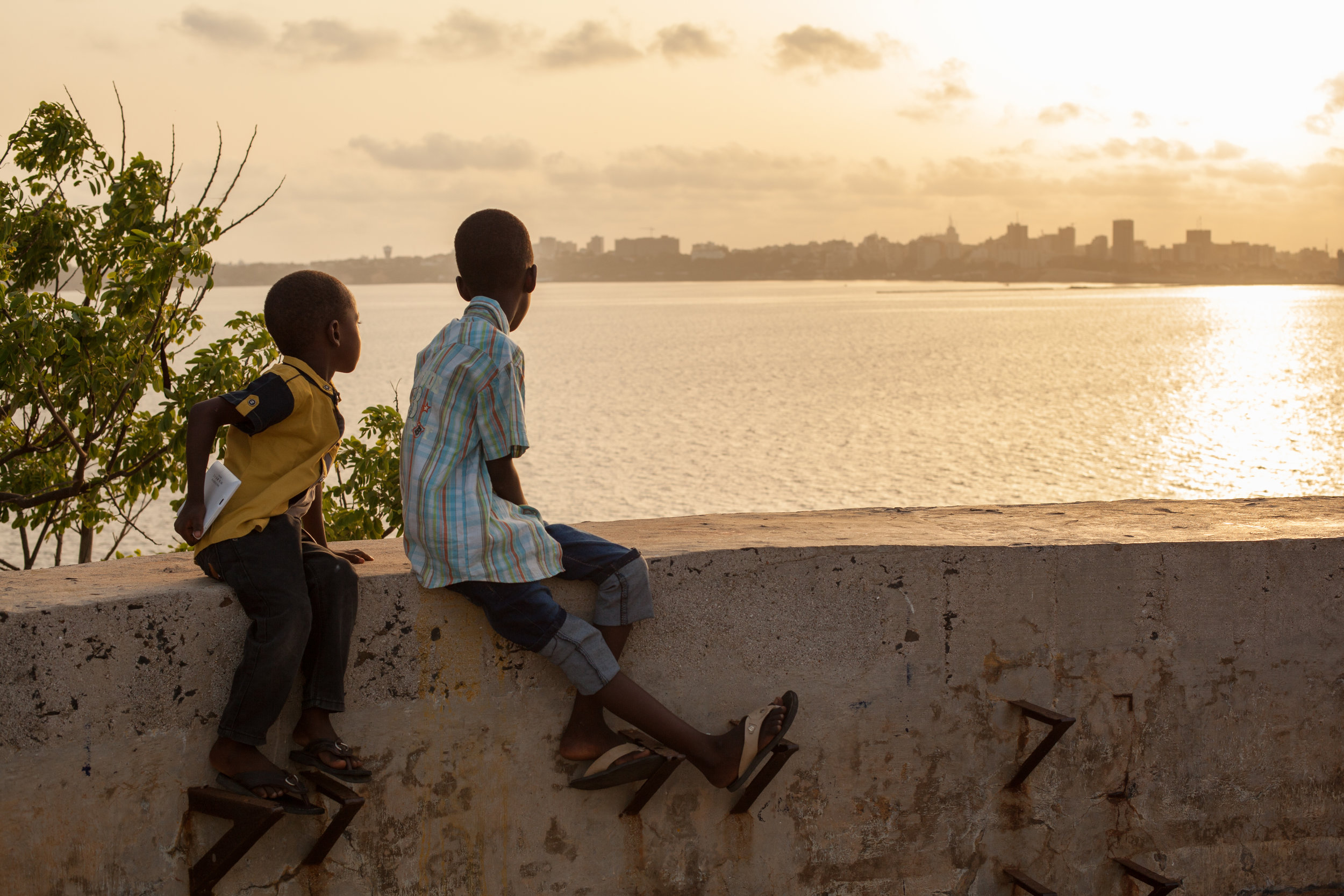 Two African boys at sunset on the Island of Gorée, Dakar, Senegal.
