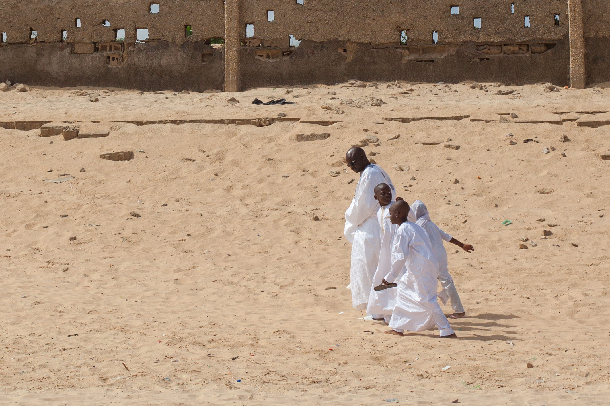 A family returning home after Sunday service at the mosque in Dakar.