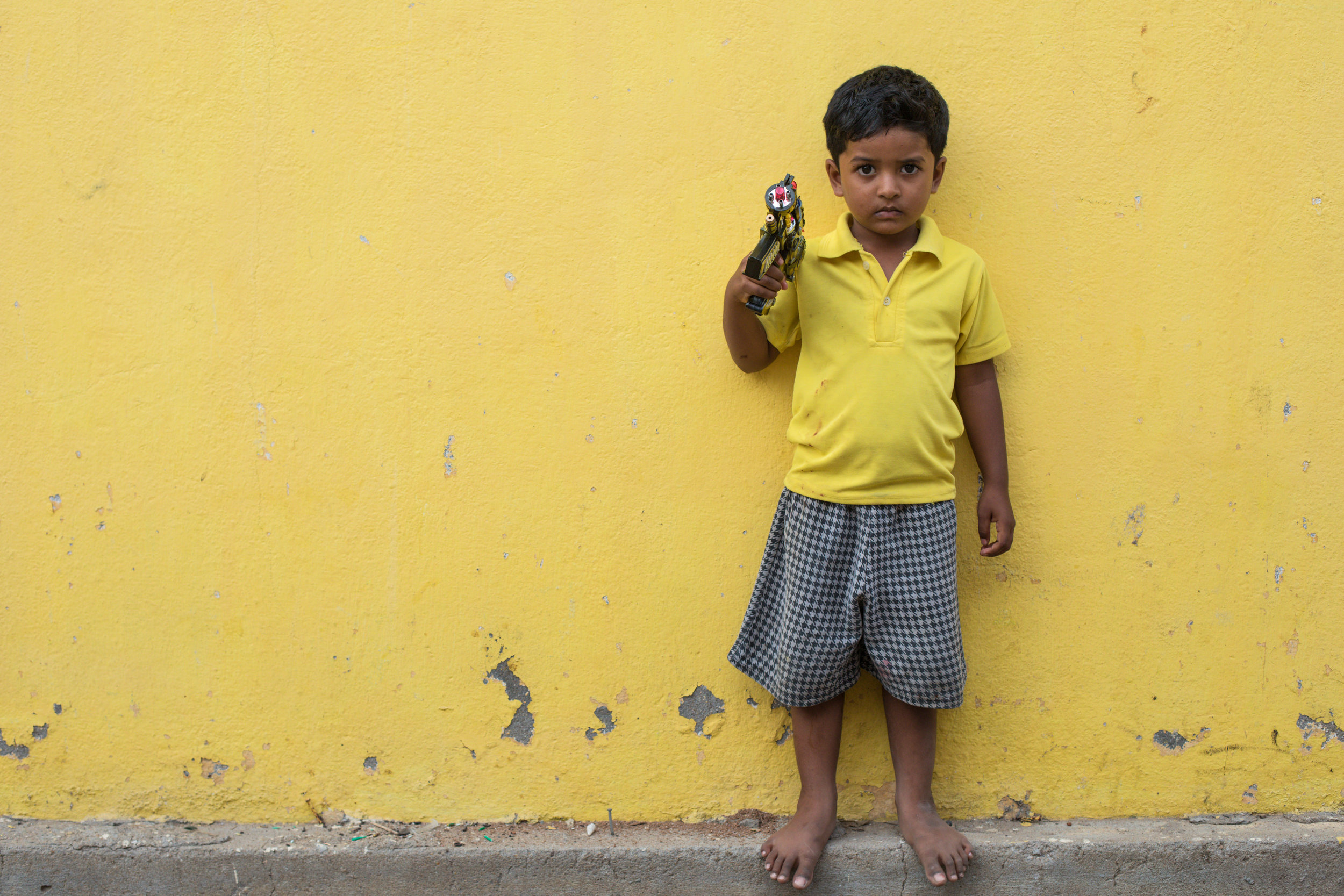 Yellow street portrait in Pondicherry, India.