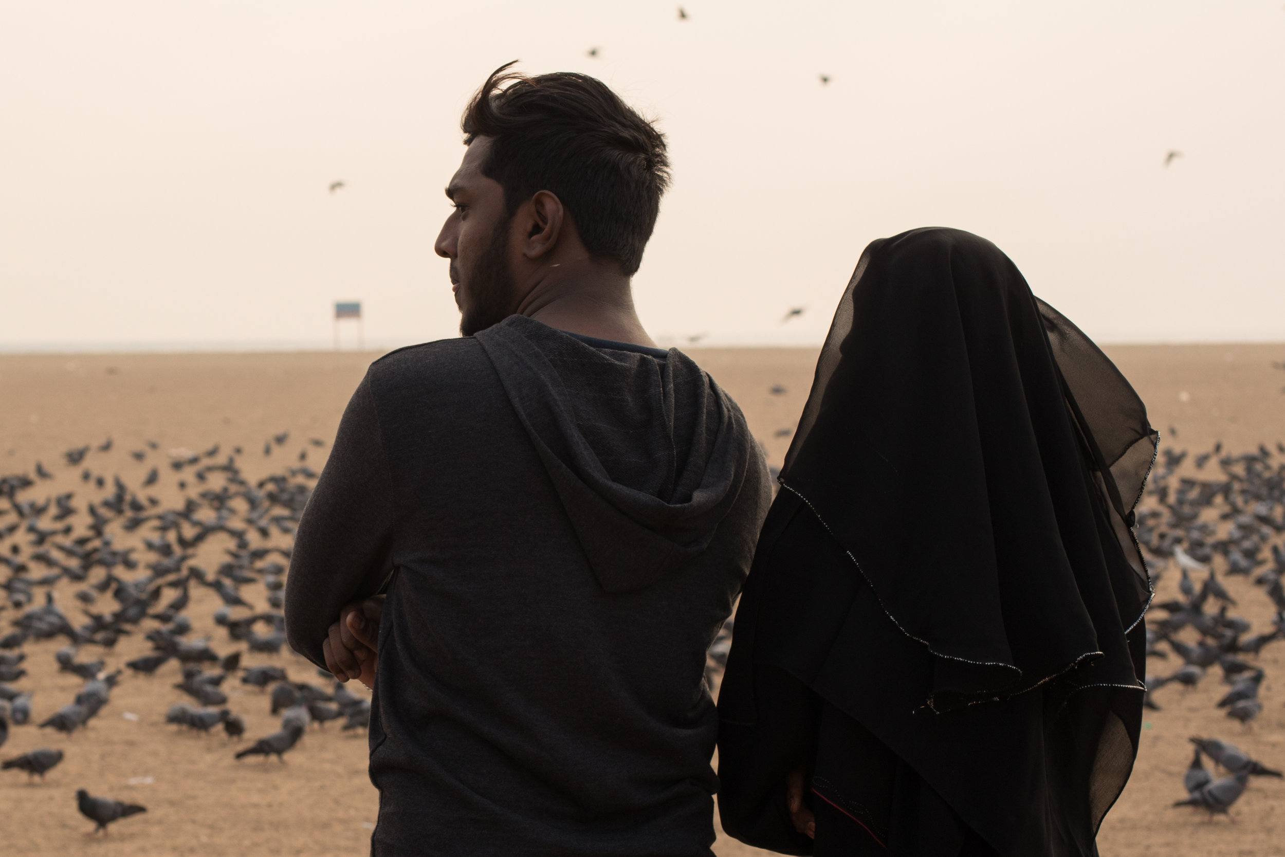 A couple at Marina beach in Chennai, India.