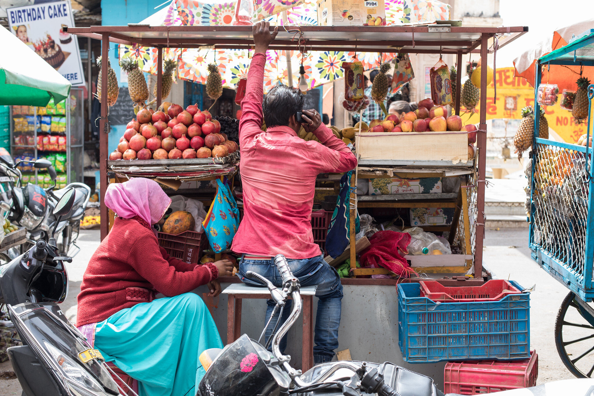 A colourful fruit seller in Pushkar in Rajasthan in India.