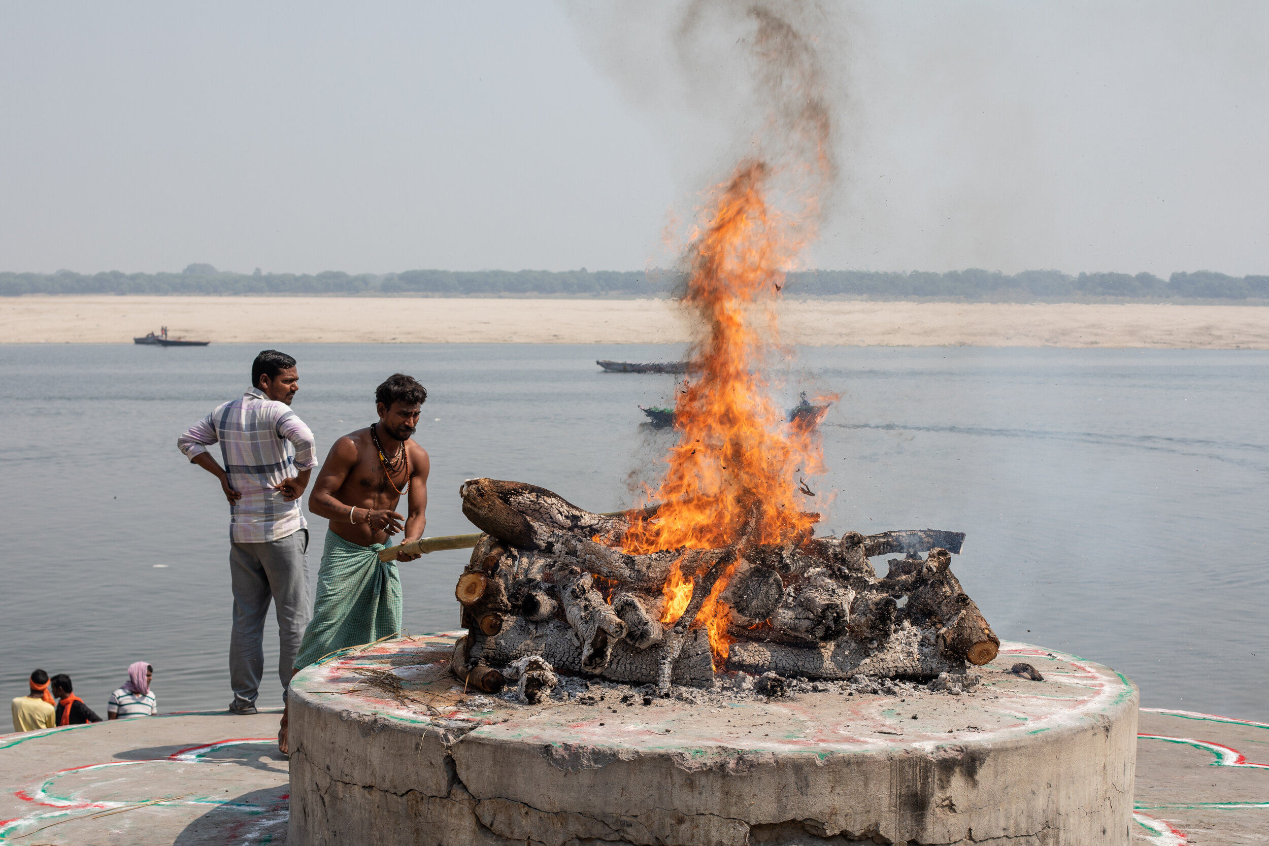 Public cremations taking place by the River Ganges in Varanasi.  