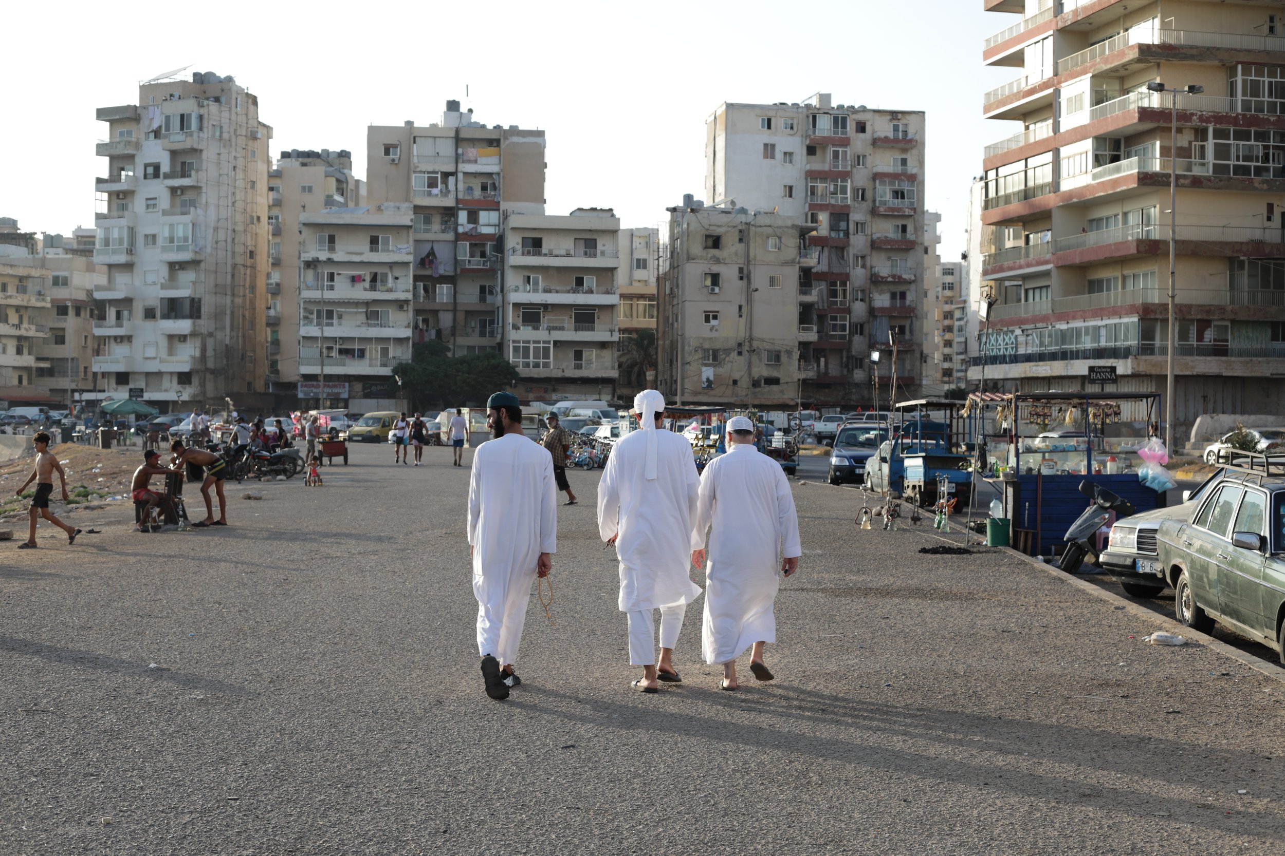 Locals walking along the seafront of Tripoli in Lebanon