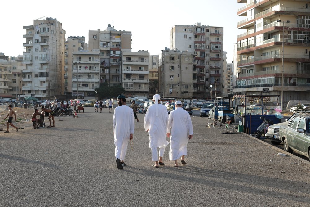 Locals walking along the seafront of Tripoli in Lebanon