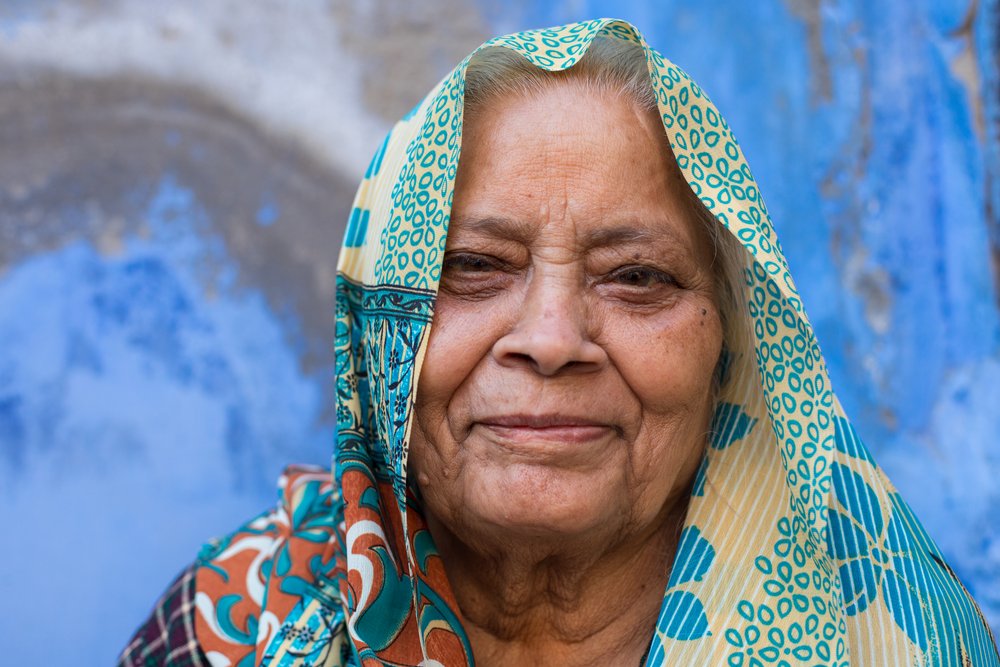 Street head shot of a colourful lady in Rajasthan, India.