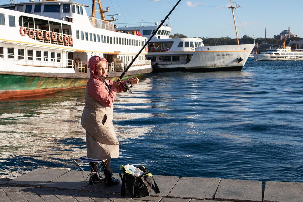 A local woman fishing on the Bosphorus in Istanbul